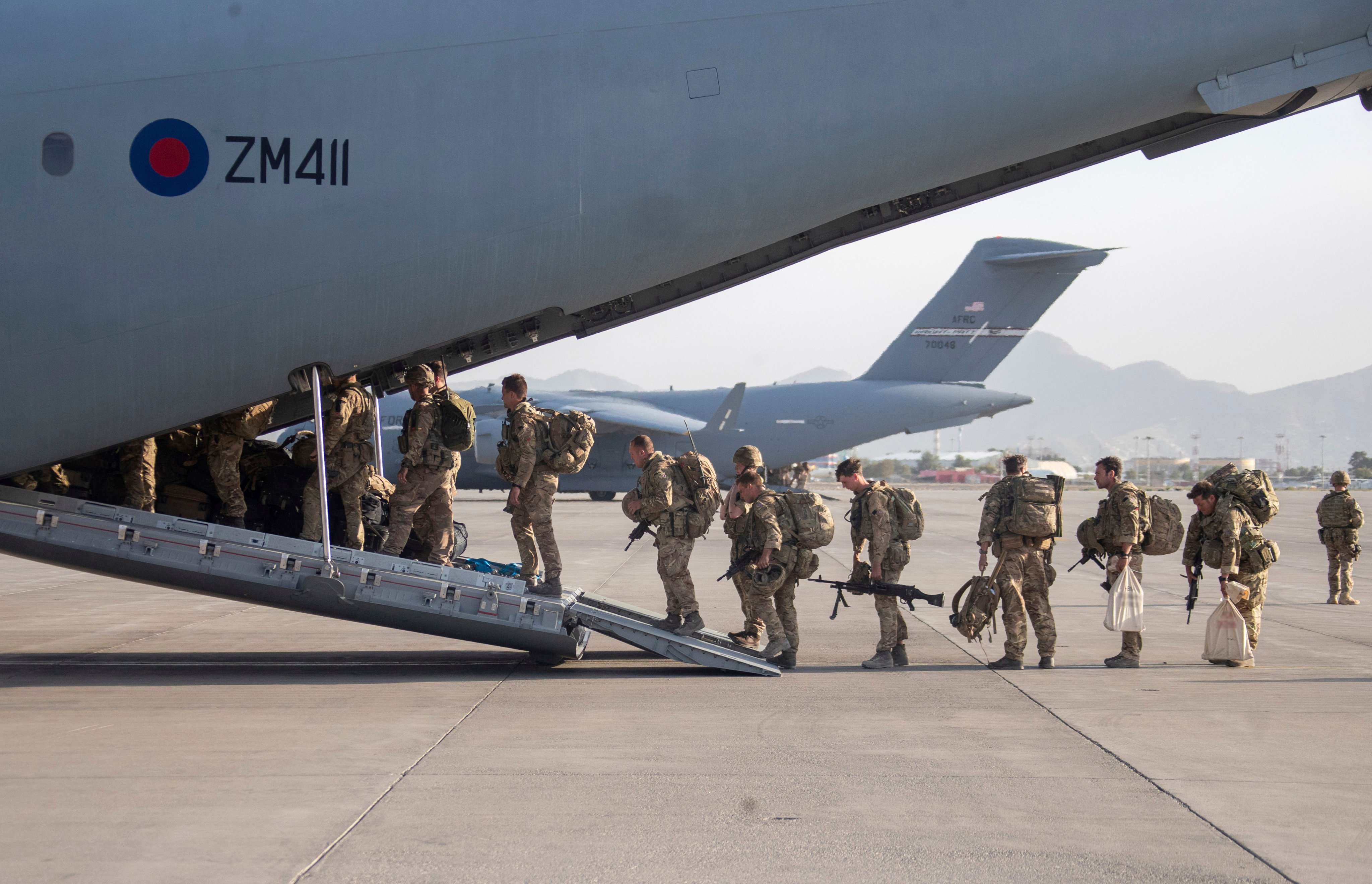 UK military personnel board an aircraft departing Kabul, Afghanistan, in August 2021. Photo: Ministry of Defence via AP