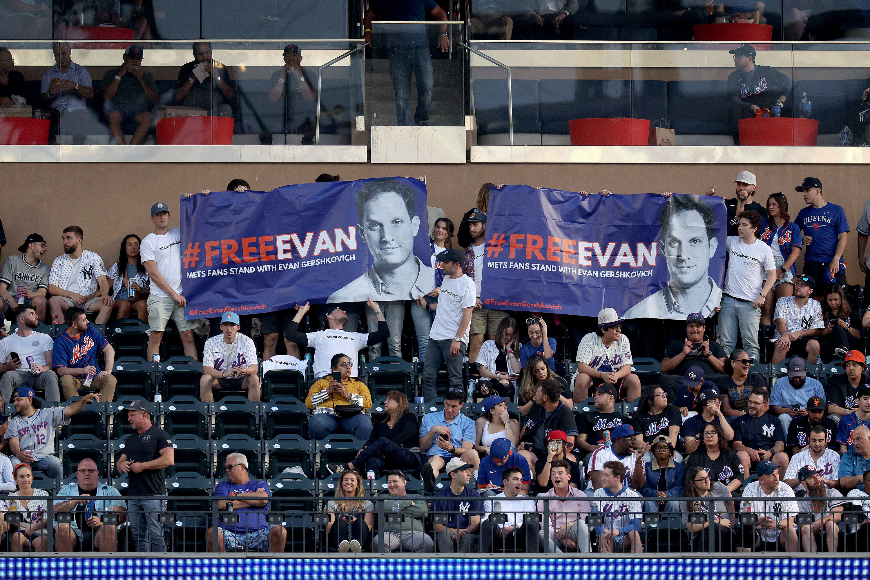 Friends of detained Wall Street Journal reporter Evan Gershkovich during a New York Mets and New York Yankees baseball game. Photo: TNS