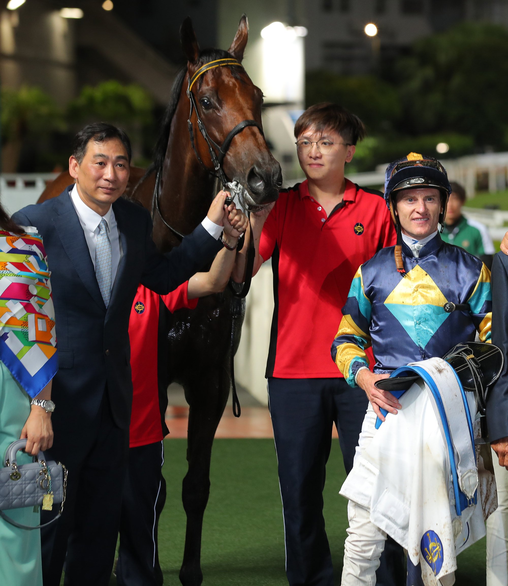 Michael Chang, Zac Purton and other connections celebrate Lady’s Choice’s win at Sha Tin on Monday.