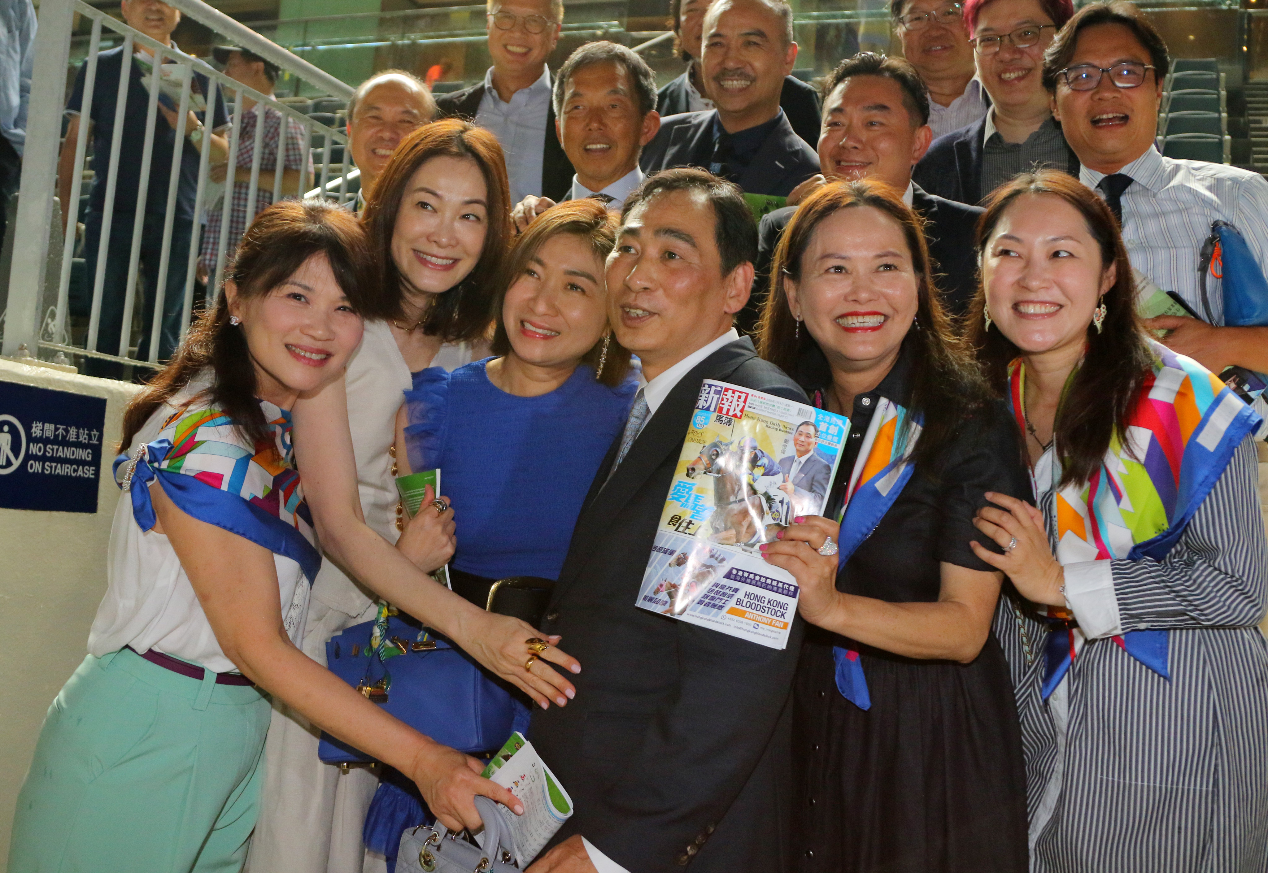 Trainer Michael Chang celebrates his career-saving win with Lady’s Choice’s owners at Sha Tin on Monday night. Photos: Kenneth Chan