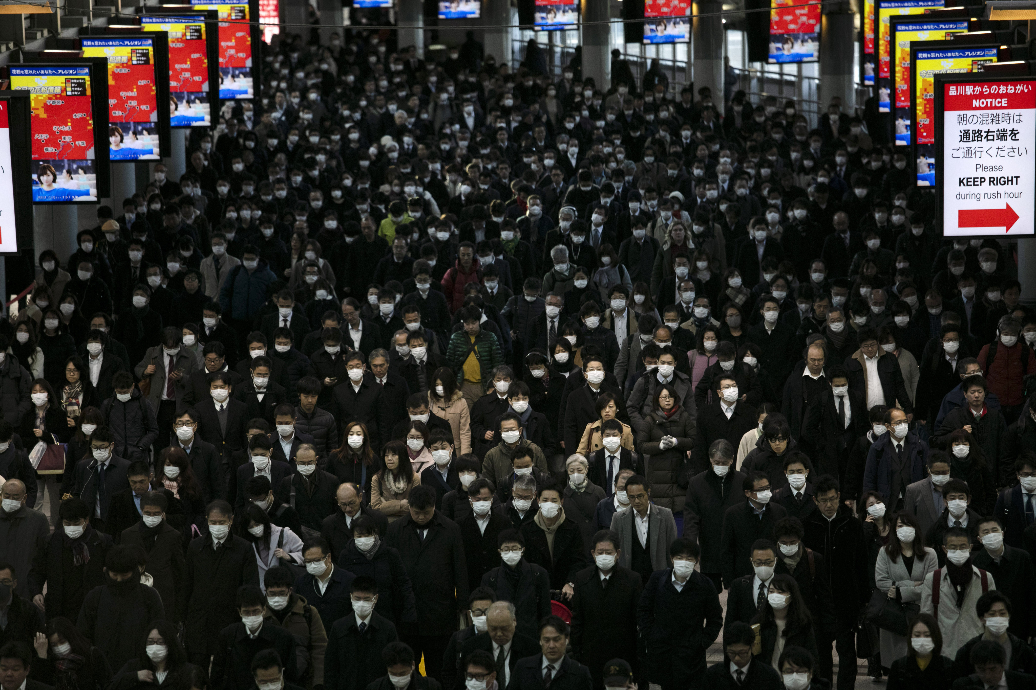 Commuters walk through Shinagawa Station in Tokyo. Many Japanese worry about being seen as troublemakers, are reluctant to question authority and may be afraid to speak up. Photo: AP
