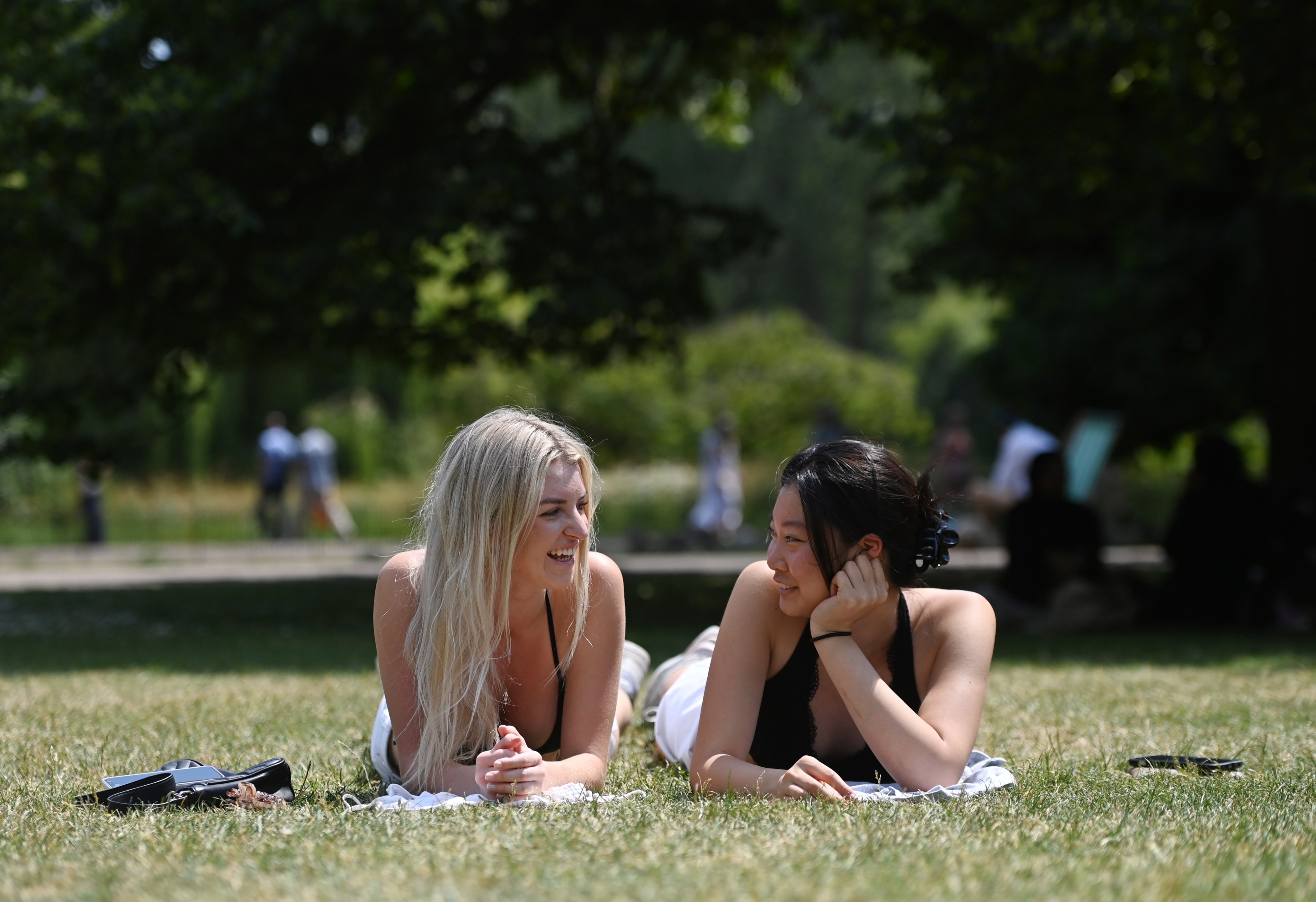 Women sunbathe in St James’ Park, London during a record-breaking heatwave in June. Photo: EPA-EFE