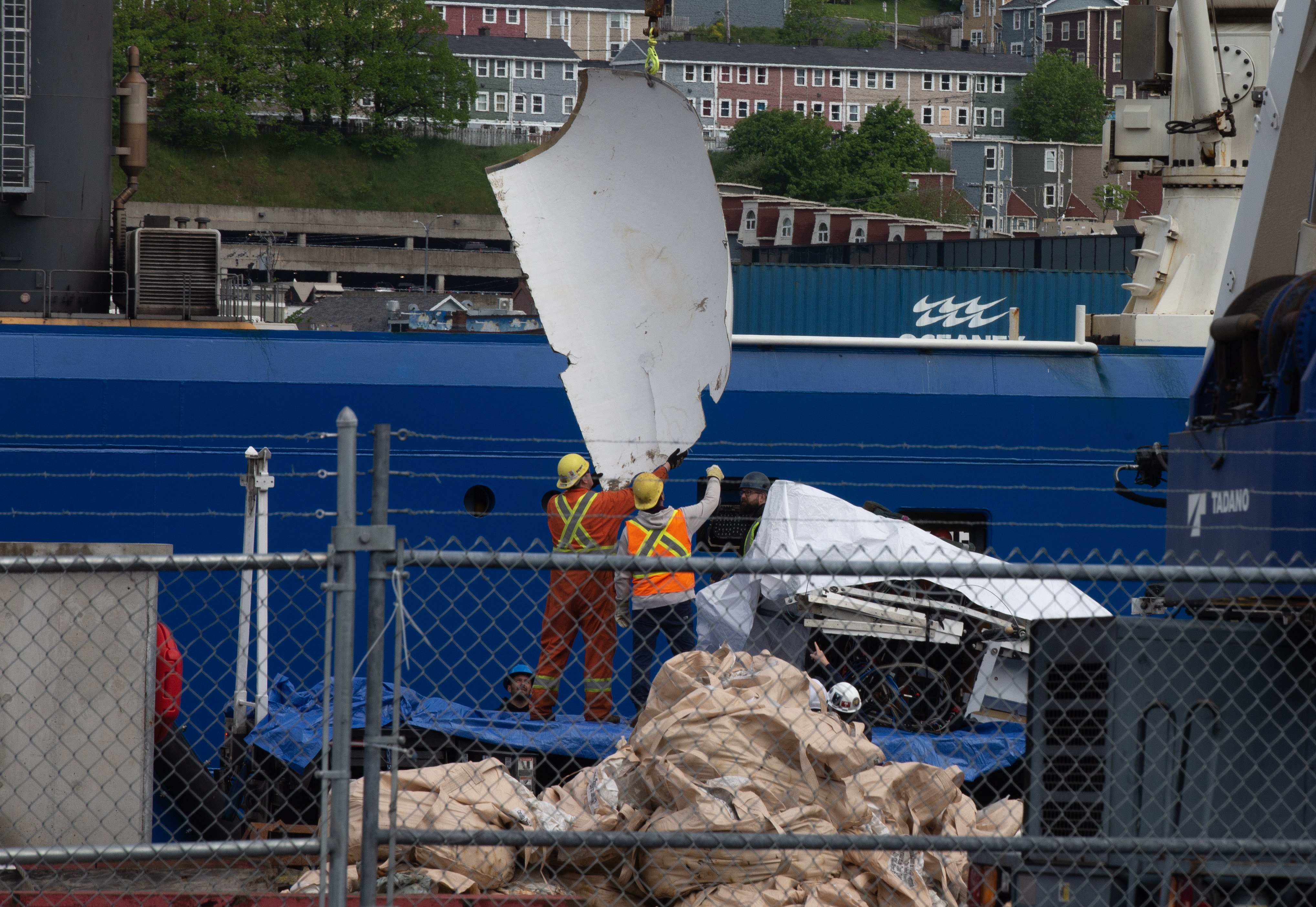 Debris from the Titan submersible, recovered from the ocean floor near the wreck of the Titanic, is unloaded from a ship at the Canadian Coast Guard pier in St John’s, Newfoundland, on June 28. Photo: dpa 