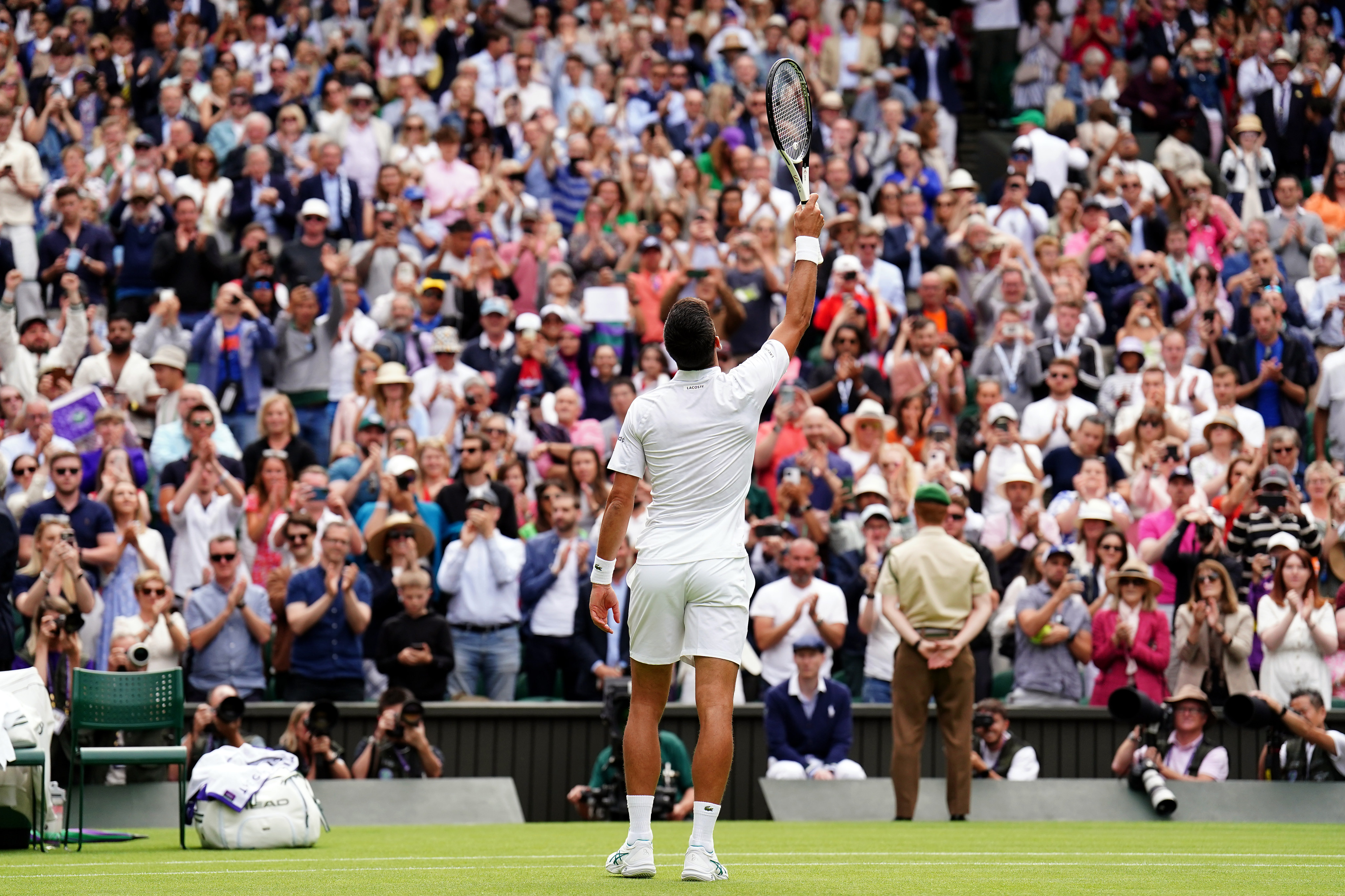 Novak Djokovic acknowledges the crowd after beating Pedro Cachin in the first round of the men’s singles at Wimbledon. Photo: DPA