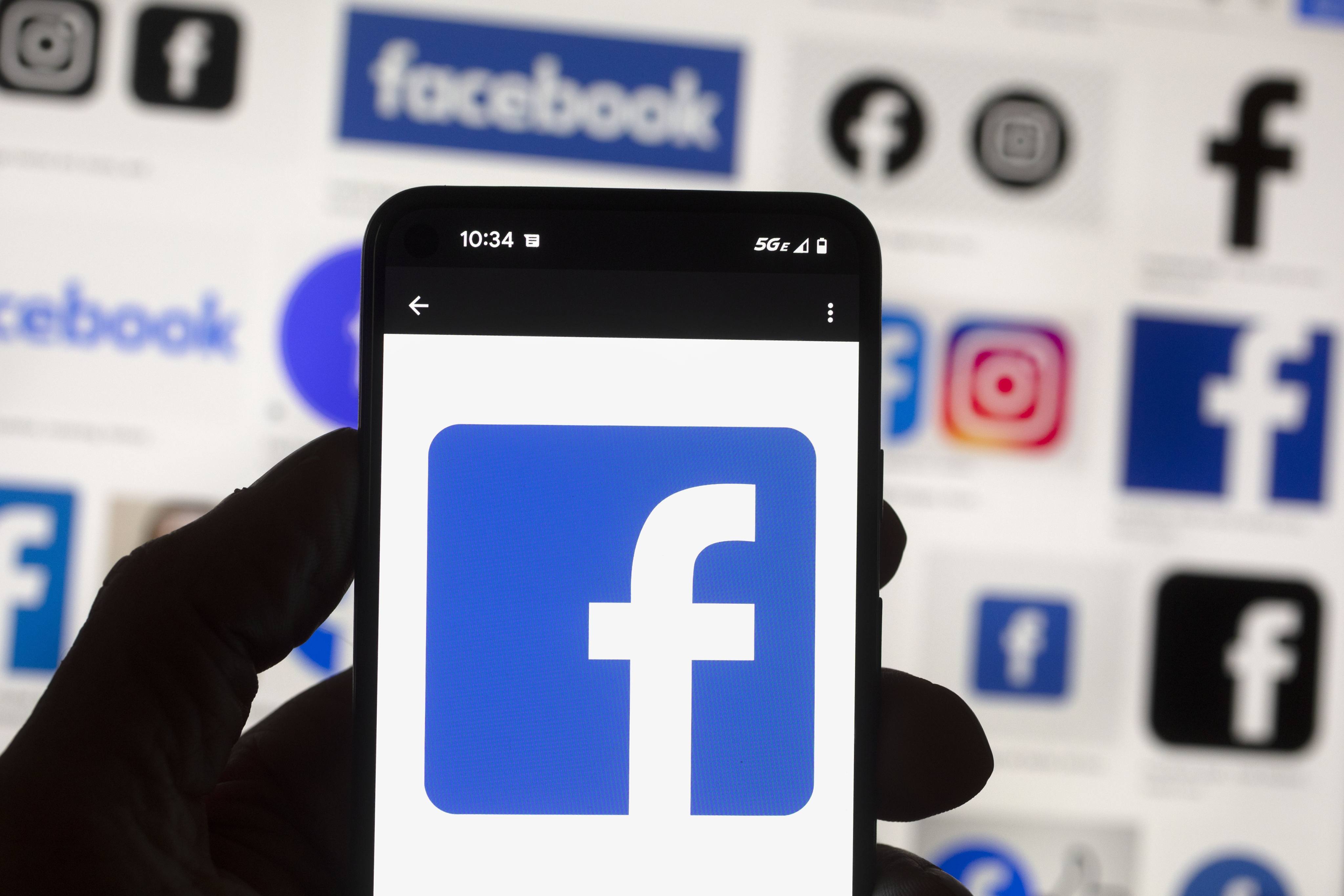 The Facebook logo displayed on a mobile phone. Photo: AP 