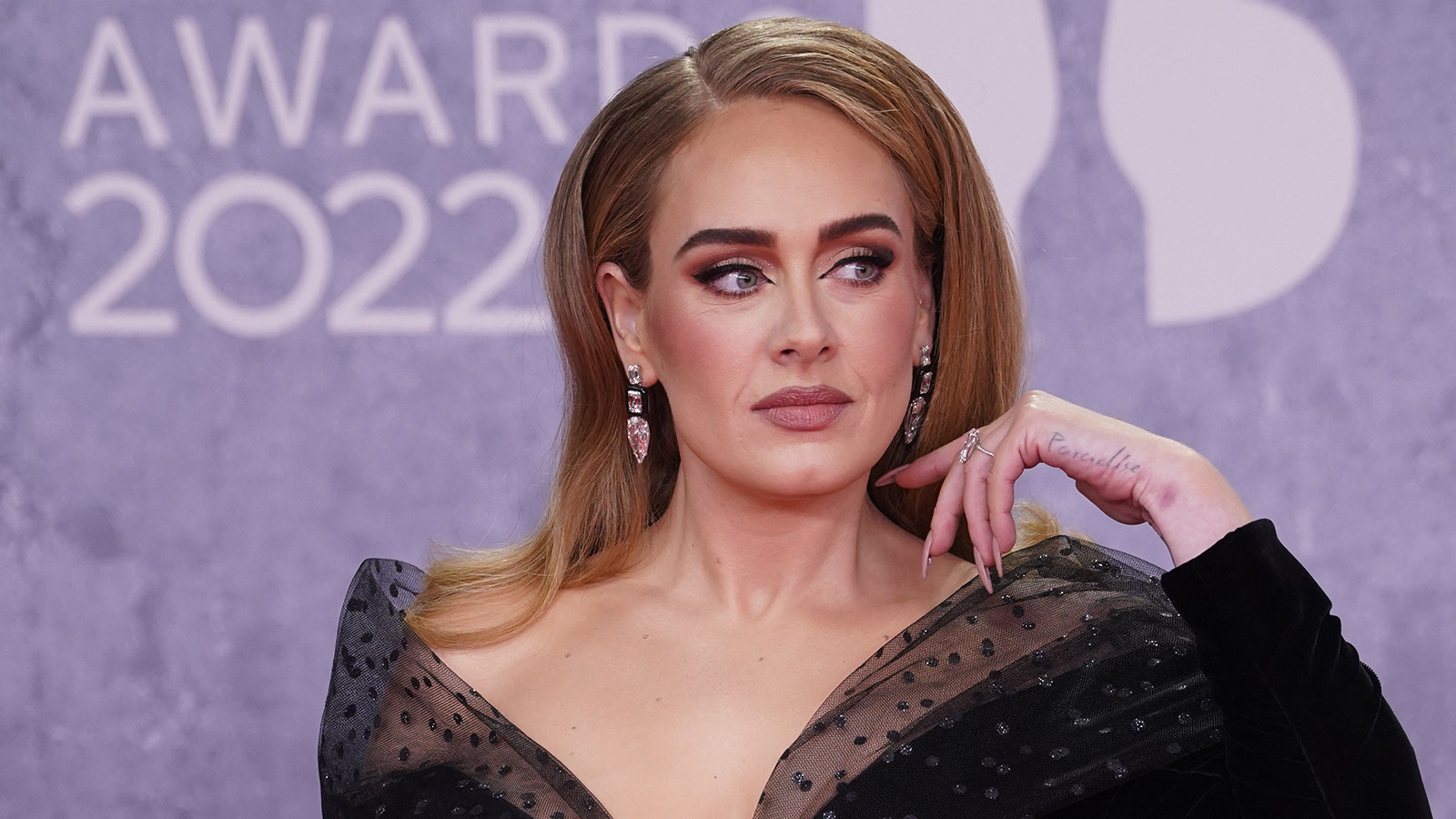 Adele poses on the red carpet at the Brit Awards in London in February 2022. Photo: TNS