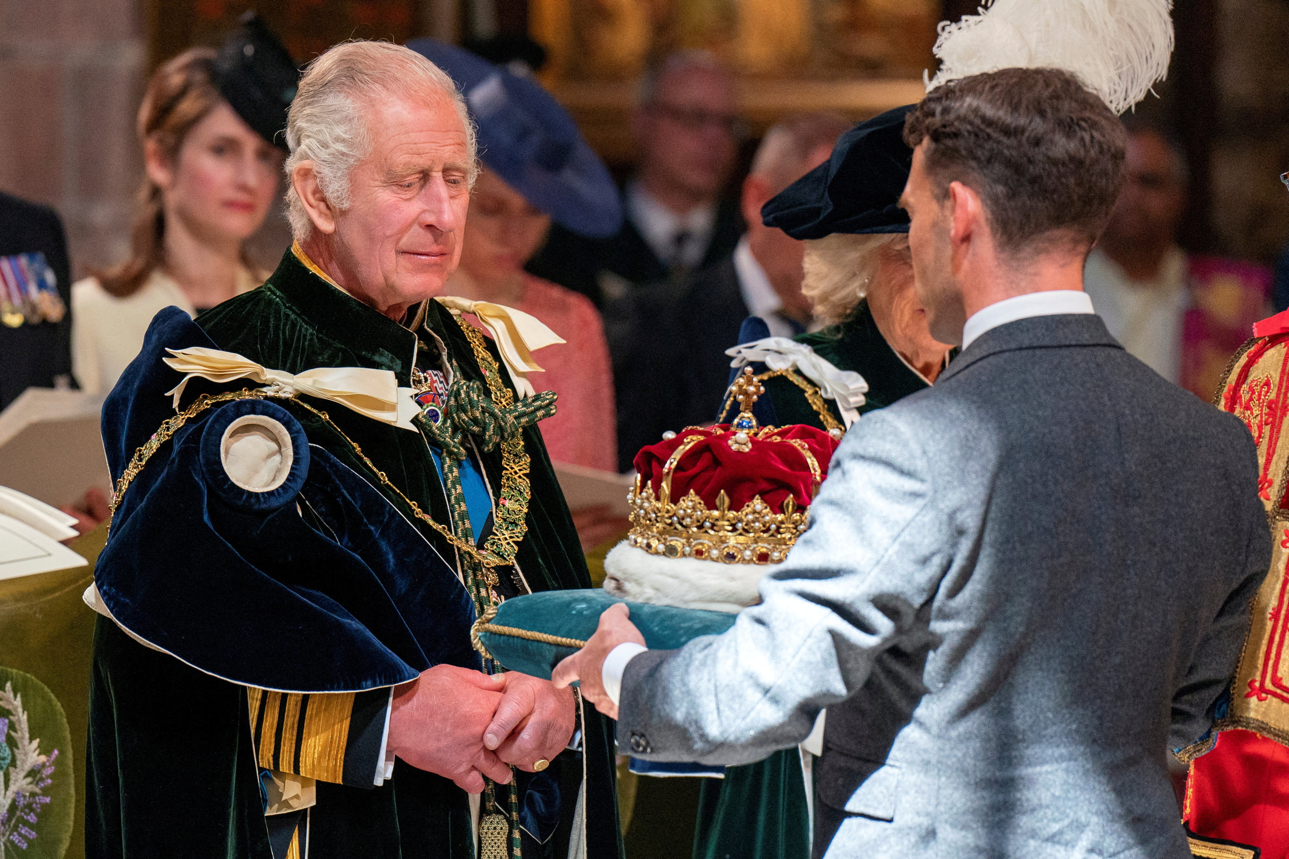 The Crown of Scotland borne by The Duke of Hamilton and Brandon is presented to Britain’s King Charles at St Giles’ Cathedral in Edinburgh on Wednesday. Photo: Reuters