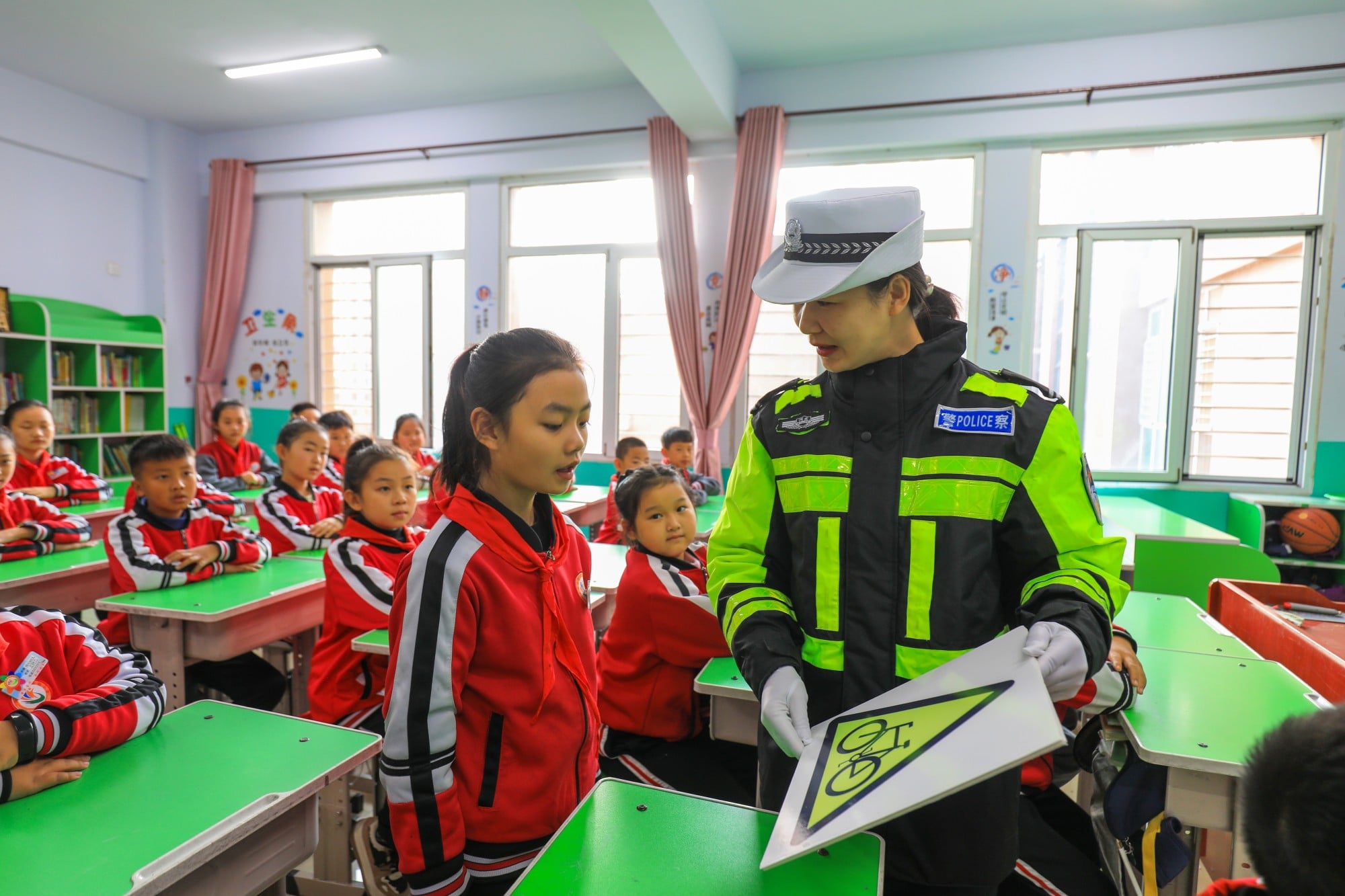 A police officer conducts a road safety lesson in a primary school classroom in China. Photo: Shutterstock A police officer conducts a road safety lesson in a primary school classroom in China. Photo: Shutterstock