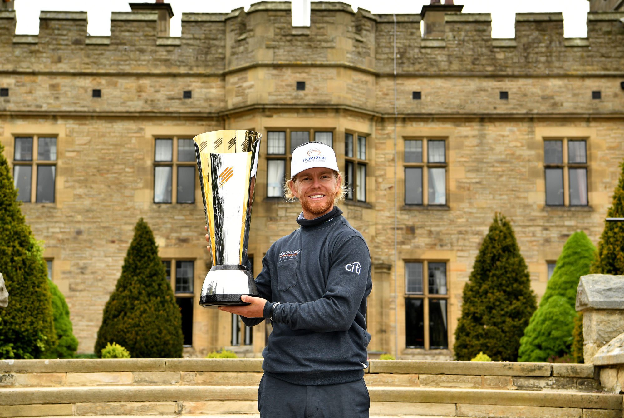 Scott Vincent holds the winner’s trophy after claiming the International Series England title at Staley Hall Hotel, Spa and Golf Resort. Photo: Asian Tour