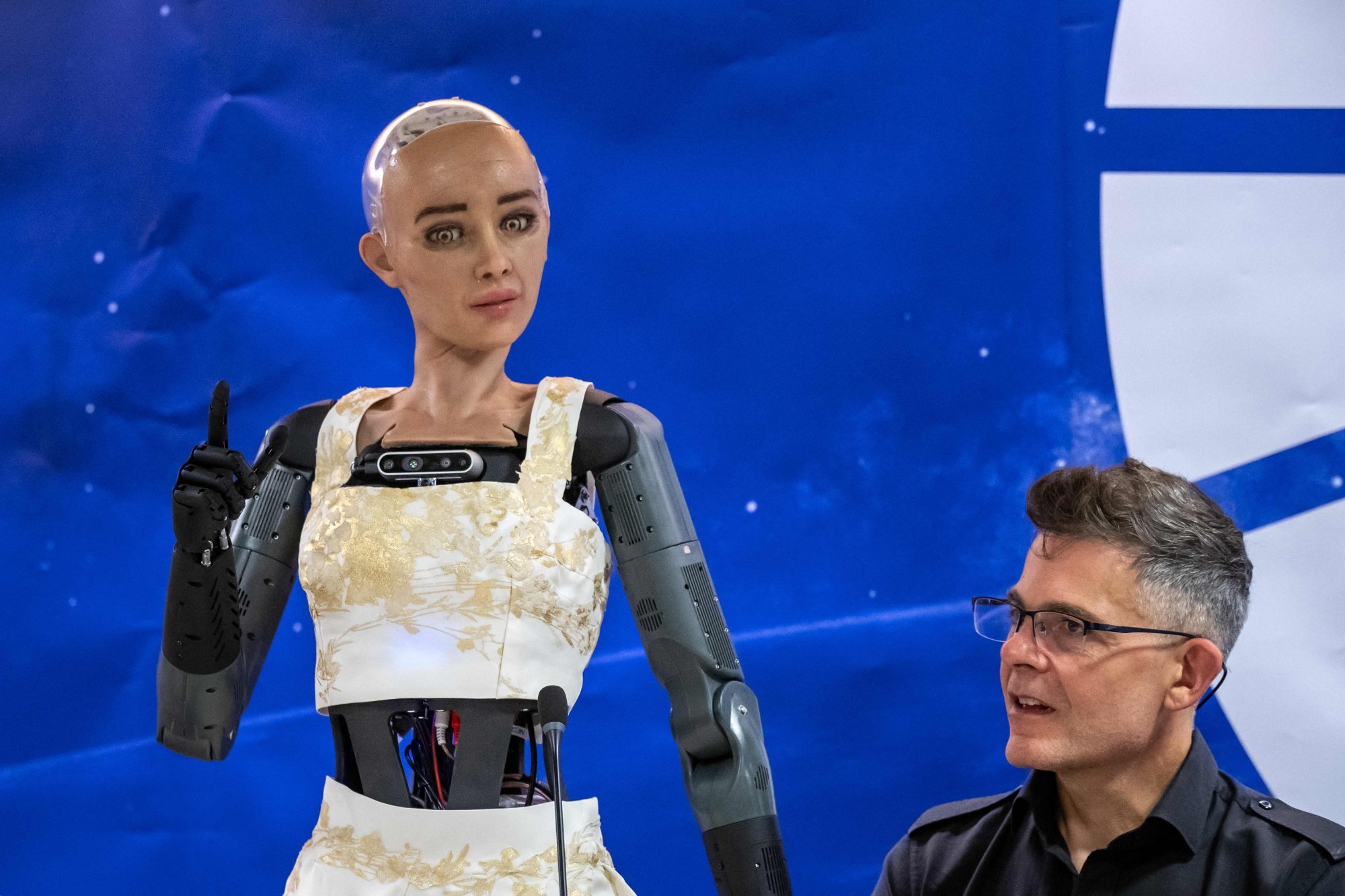 Hanson Robotics CEO David Hanson, right, listens to AI robot Sophia at the International Telecommunication Union (ITU) AI for Good Global Summit in Geneva, Switzerland on Friday. Photo: AFP