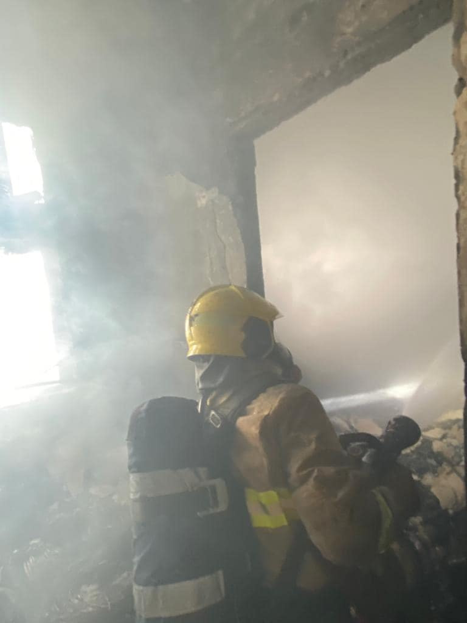 Hong Kong firefighters evacuate flats after fire breaks out on 13th