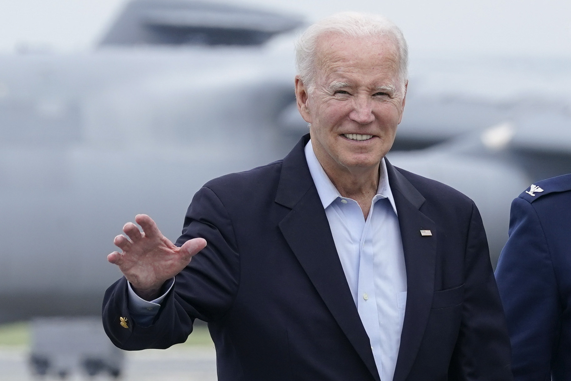 US President Joe Biden waves as he prepares to board Air Force One in Delaware, US on Sunday for his flight to Britain. Photo: AP