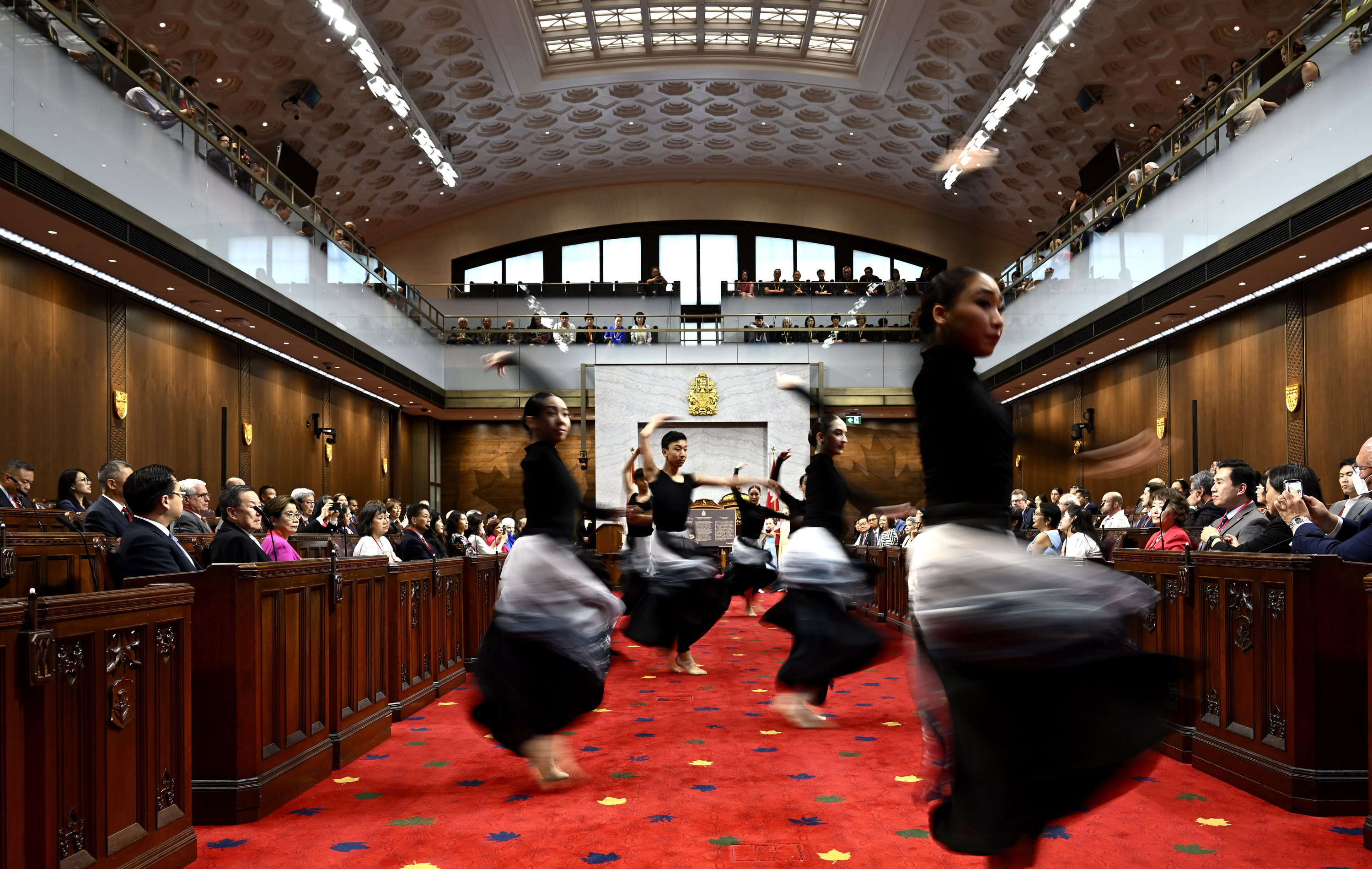 Dancers from Goh Ballet perform during the National Remembrance Ceremony for the 100th Anniversary of the Introduction of the Chinese Exclusion Act, on June 23 in the Senate Chamber in Ottawa. Photo: The Canadian Press via AP