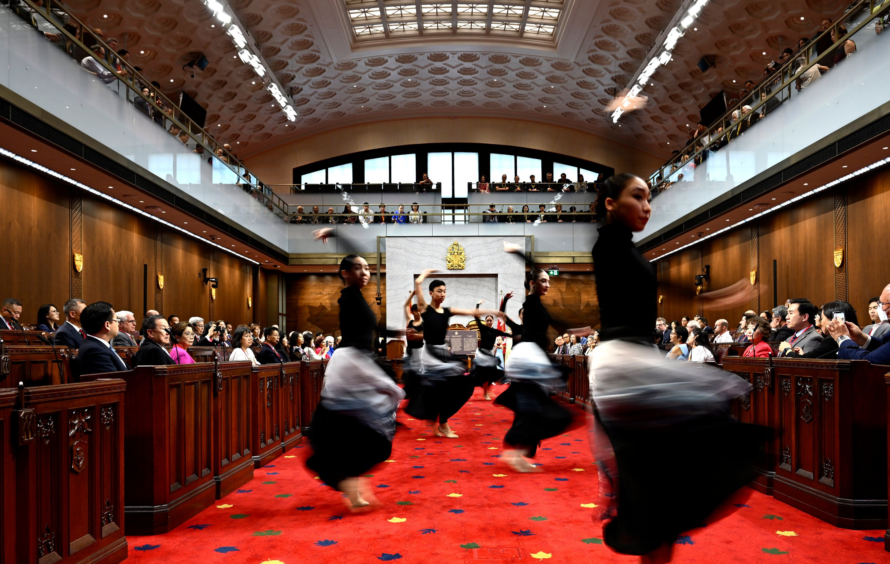 Dancers from Goh Ballet perform during the National Remembrance Ceremony for the 100th Anniversary of the Introduction of the Chinese Exclusion Act, on June 23 in the Senate Chamber in Ottawa. Photo: The Canadian Press via AP