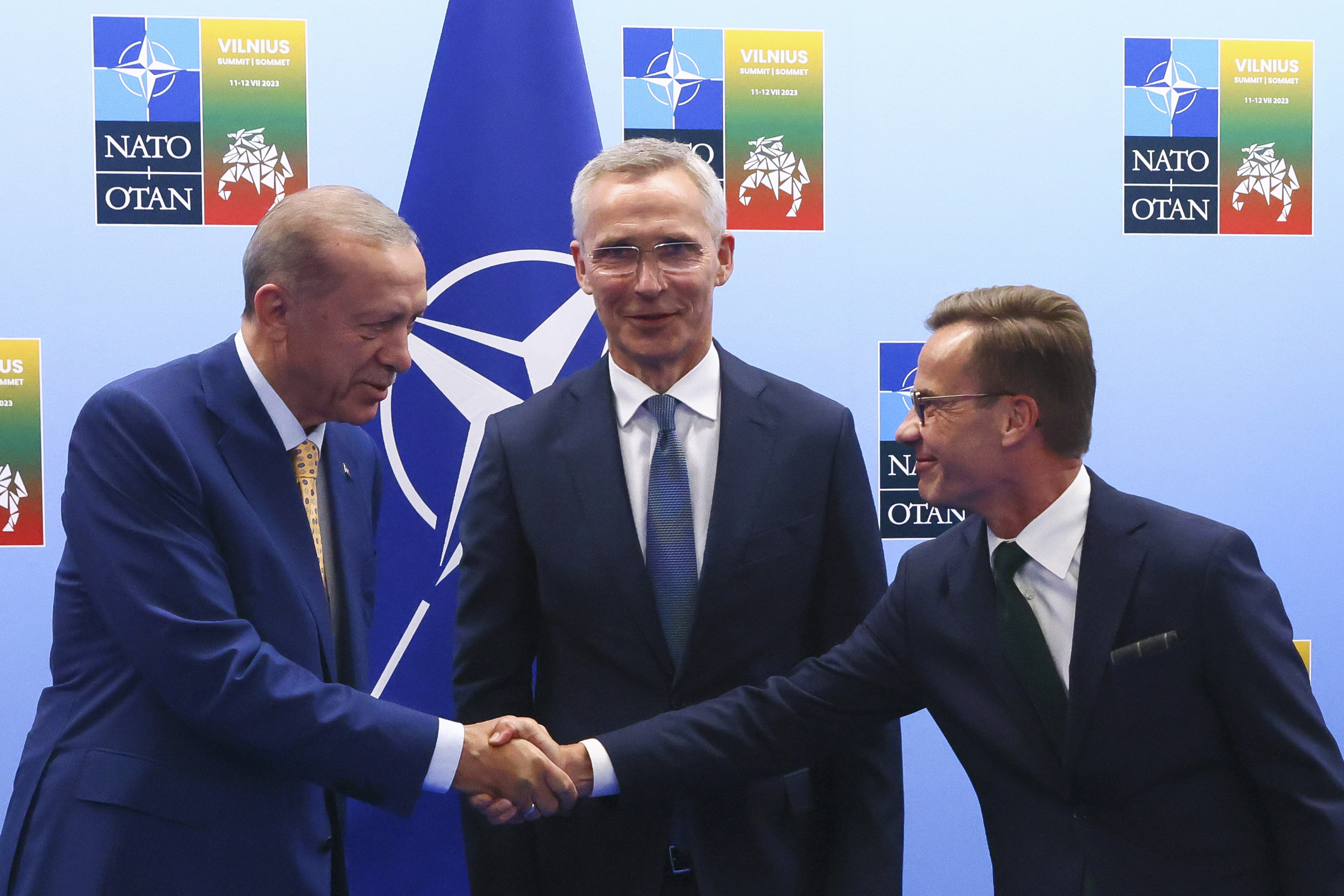 Turkey’s President Recep Tayyip Erdogan, left, shakes hands with Sweden’s Prime Minister Ulf Kristersson, right, as Nato chief Jens Stoltenberg looks on in Vilnius, Lithuania on Monday, Photo: Pool Photo via AP