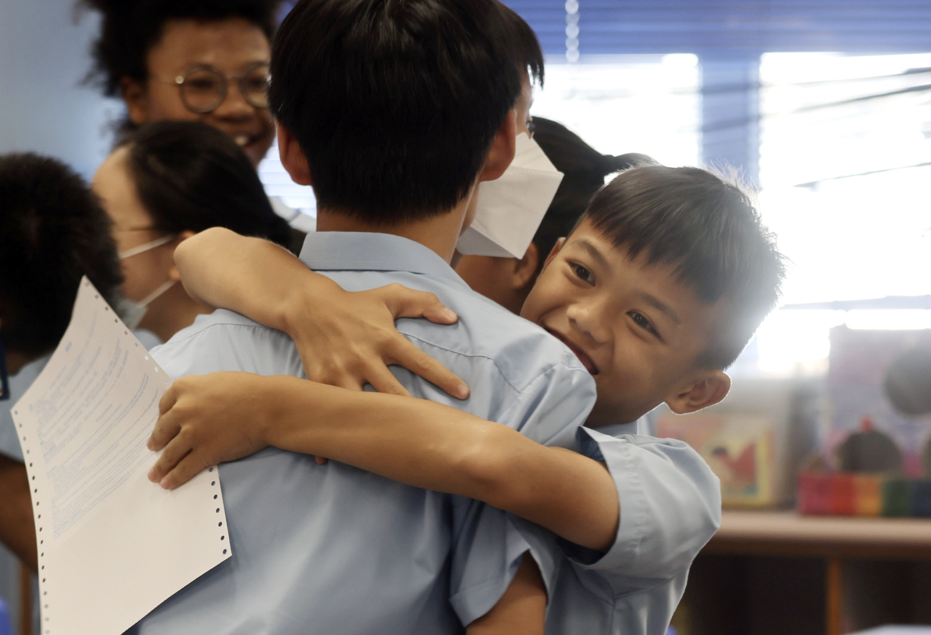 Happy students receive their allocation results at Yaumati Catholic Primary School (Hoi Wang Road). Photo: Jonathan Wong