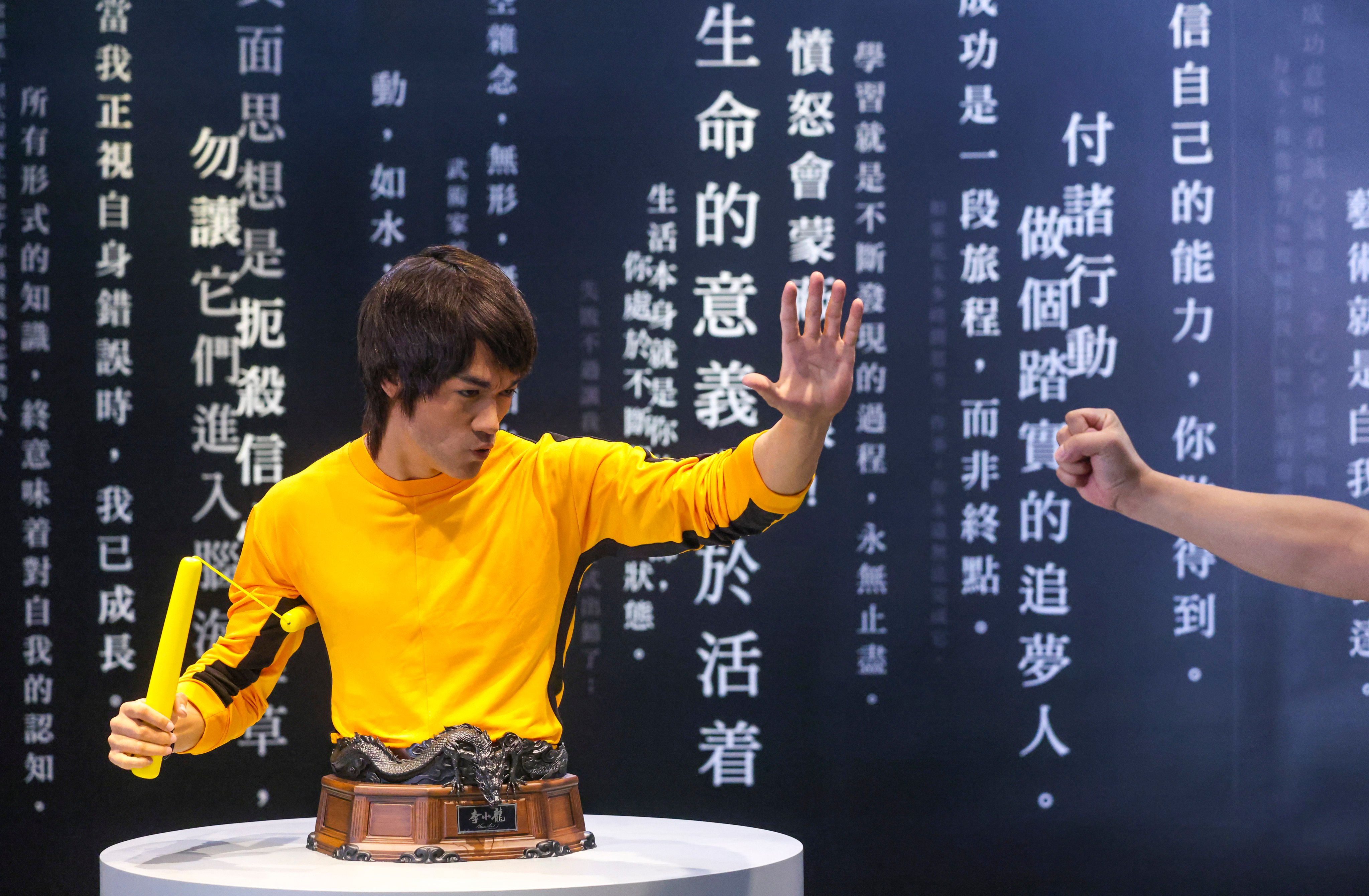 The Hong Kong Heritage Museum show includes a life-size bust of Bruce Lee with nunchucks. Photo: May Tse