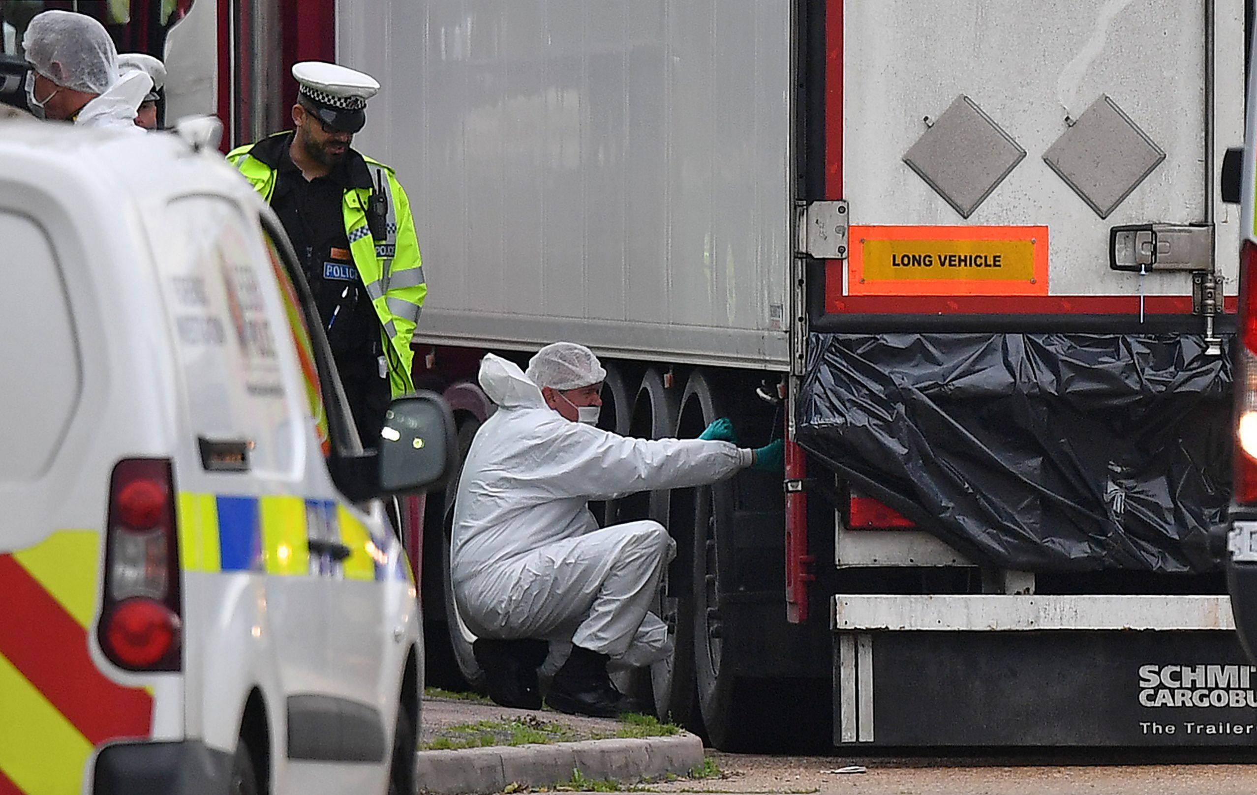 UK forensics officers work on a lorry, found to be containing the dead bodies of 39 Vietnamese migrants, at an industrial park near London in October 2019. Photo: AFP