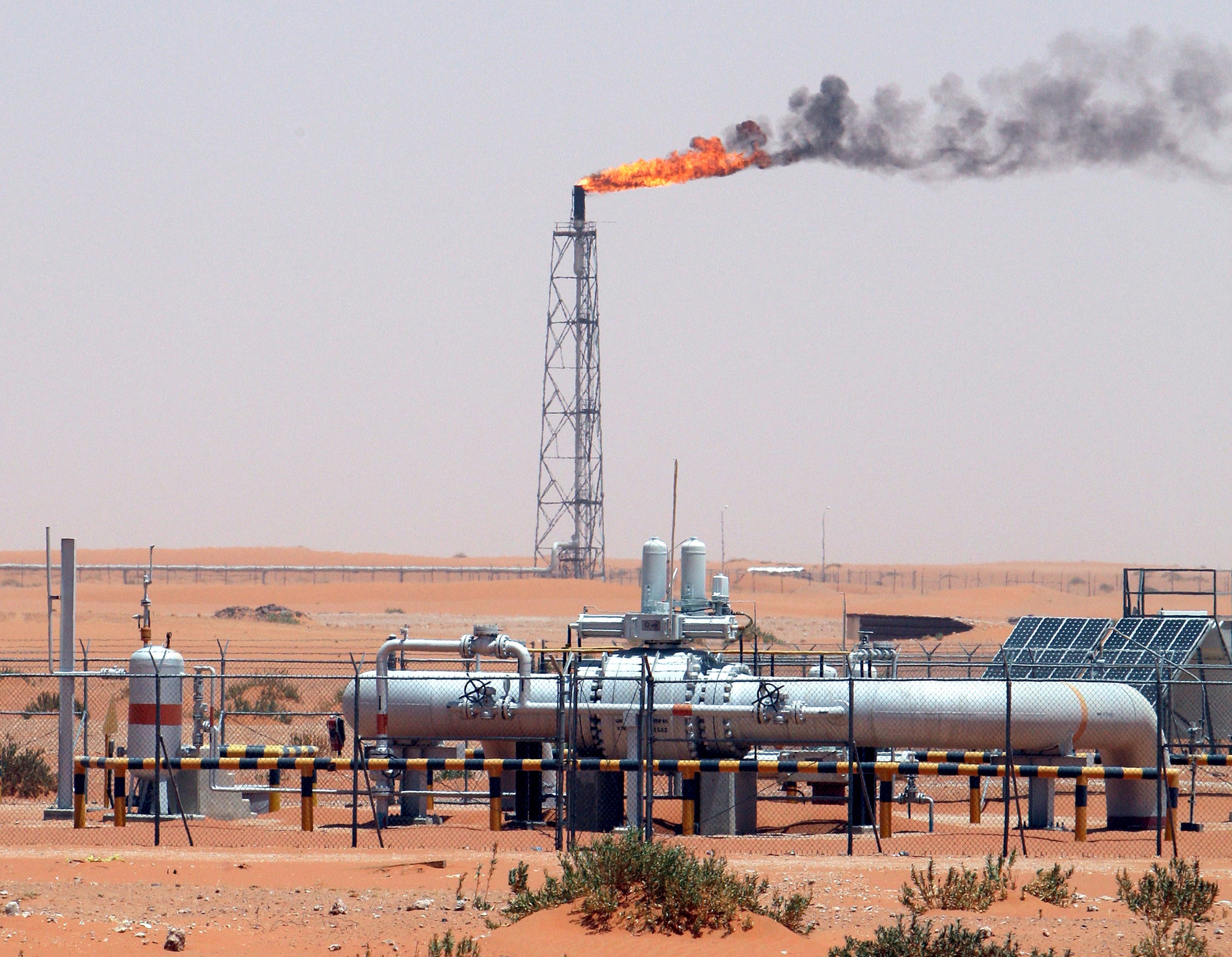 A flare stack burns off unwanted excess gas at the Khurais oil field in Saudi Arabia. Major producers such as Saudi Arabia and Russia are intensifying production cuts to support prices. Photo: EPA-EFE