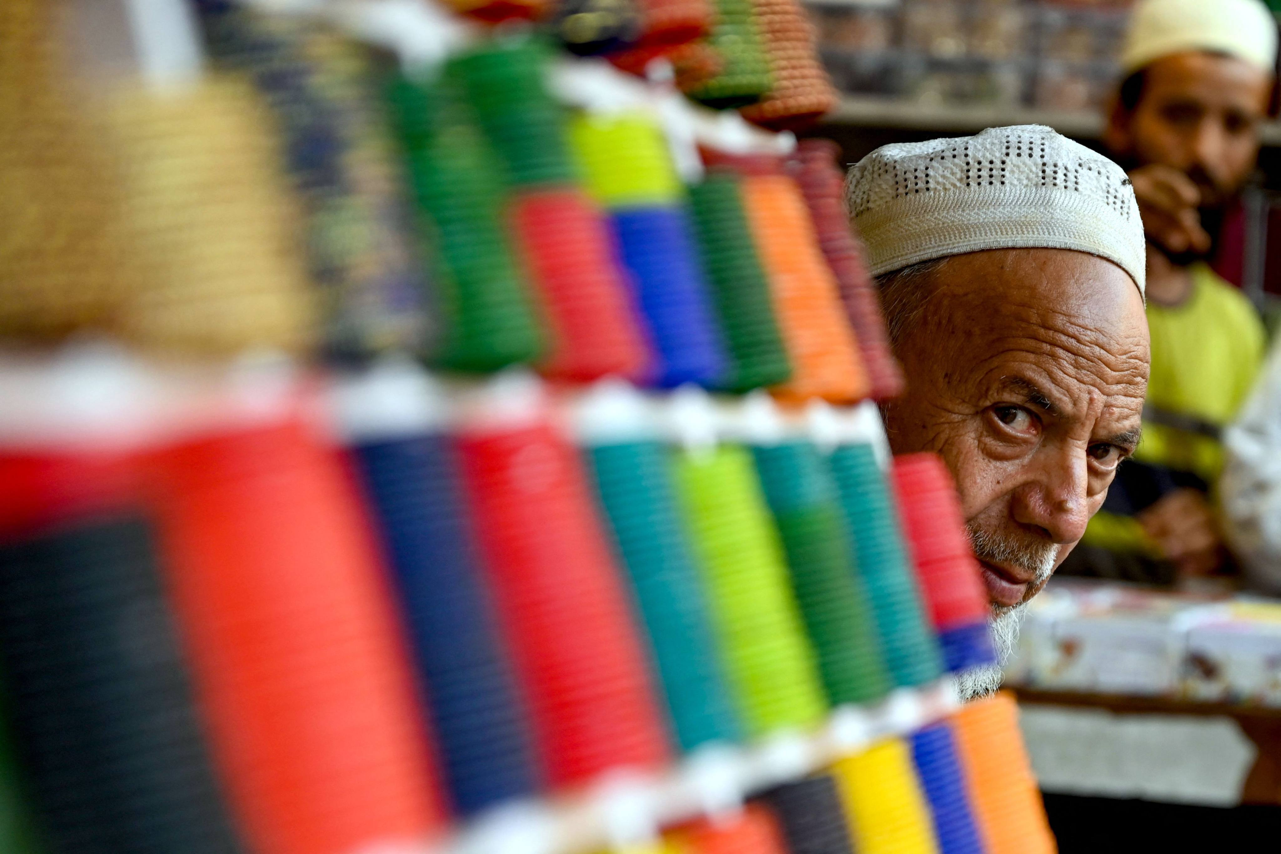 A vendor selling bangles waits for customers at a market in Bulandshahr in the Indian state of Uttar Pradesh on March 11. An interest rate cut is expected in India towards the end of this year or early next year. Photo: AFP