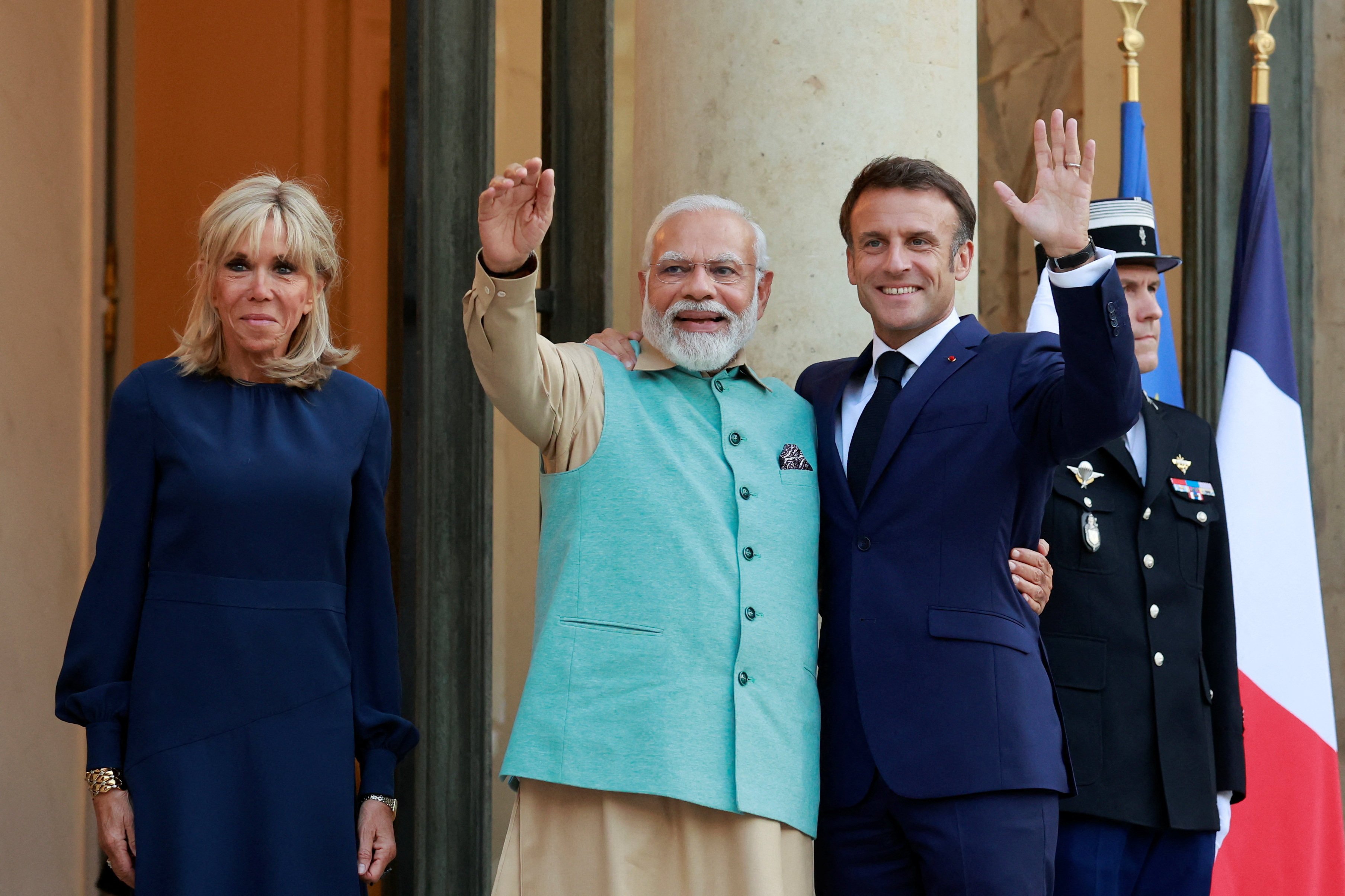 French President Emmanuel Macron and his wife Brigitte Macron welcome Indian Prime Minister Narendra Modi at the Elysee Palace, in Paris, France. Photo: Reuters
