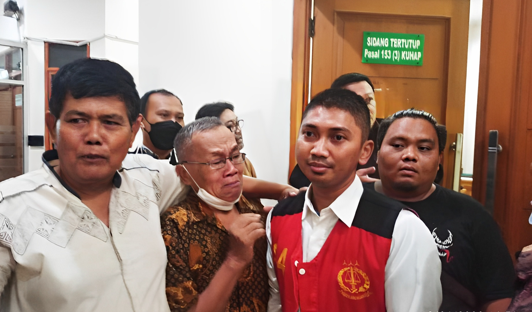 Nugroho (in the red vest) is now in jail while awaiting trial at the South Jakarta District Court. Photo: Handout