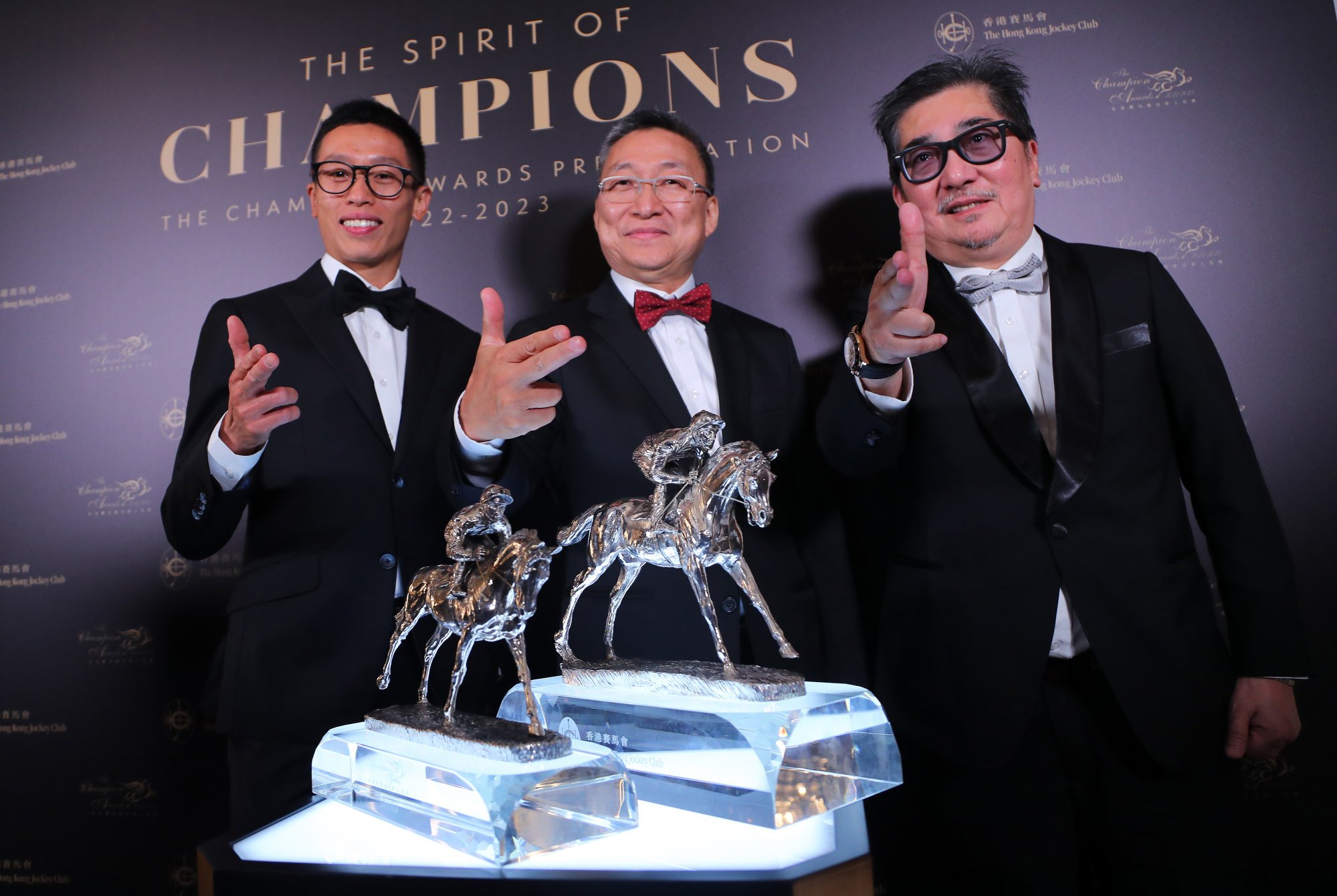 Jockey Vincent Ho (left), trainer Francis Lui and owner Stanley Chan celebrate Golden Sixty’s Horse of the Year hat-trick on Friday night. Jockey Vincent Ho (left), trainer Francis Lui and owner Stanley Chan celebrate Golden Sixty’s Horse of the Year hat-trick on Friday night.