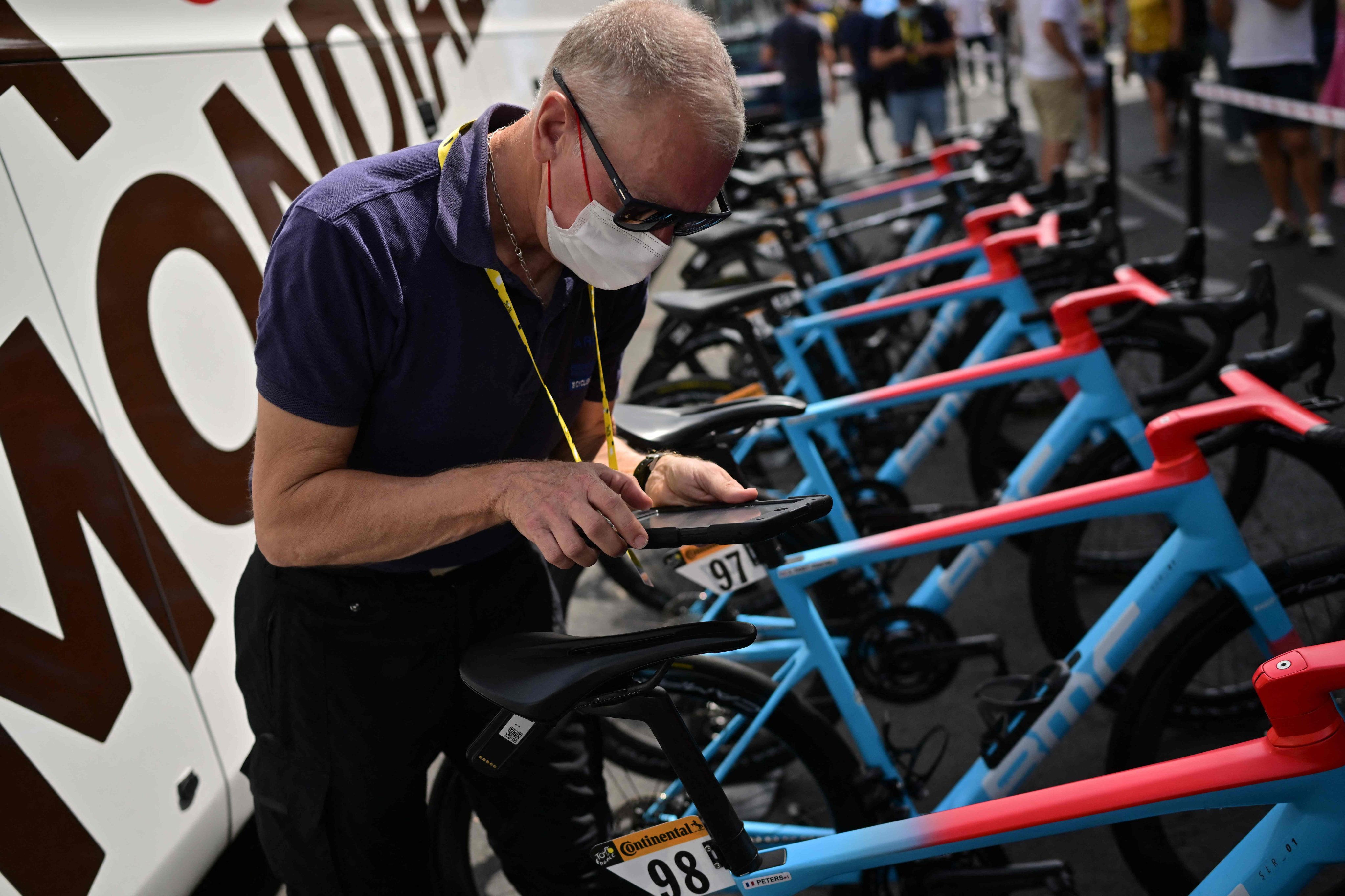 A UCI (Union Cycliste Internationale) official performs a technical control on AG2R Citroen Team bicycles before the start of the 11th stage of the 110th edition of the Tour de France. Photo: AFP