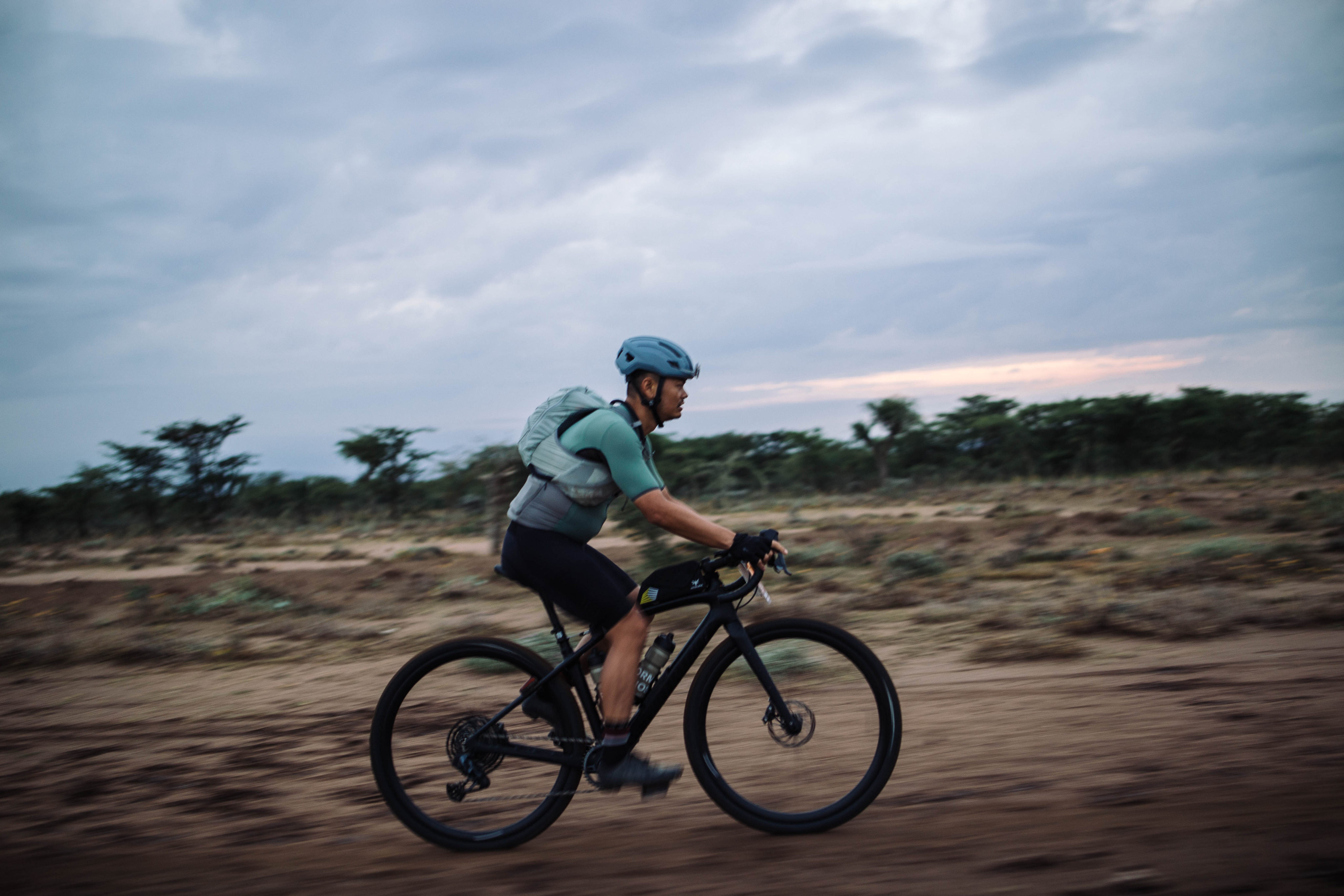 Cody Lin of Taiwan races across the savannah. It’s his first time in Africa, and he says he’s elated to be exploring Kenya through then the Migration Gravel Race. Photo: Kang-Chun Cheng