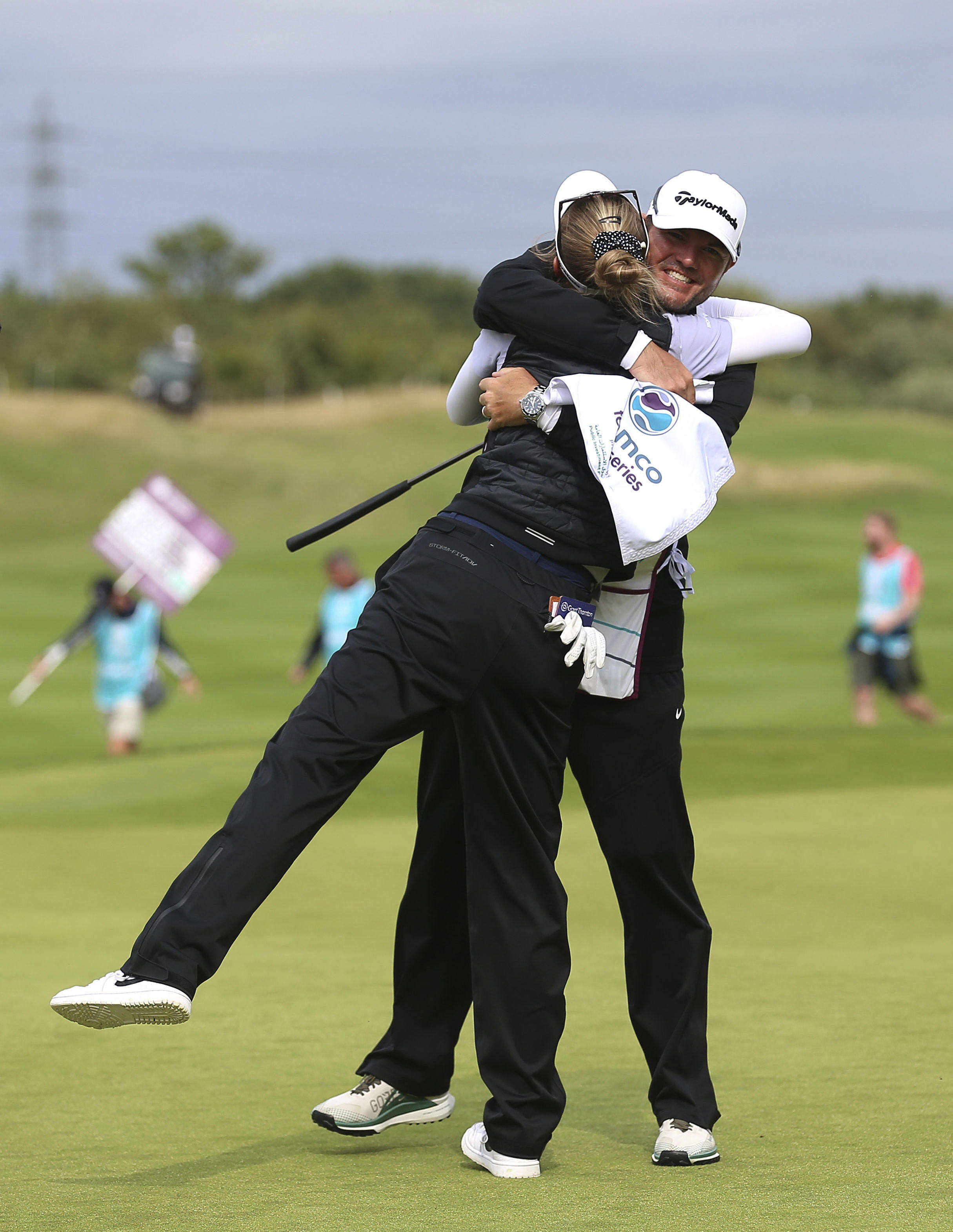 Nelly Korda celebrates winning the Aramco Team Series at the Centurion Club with her caddie. Photo: AP