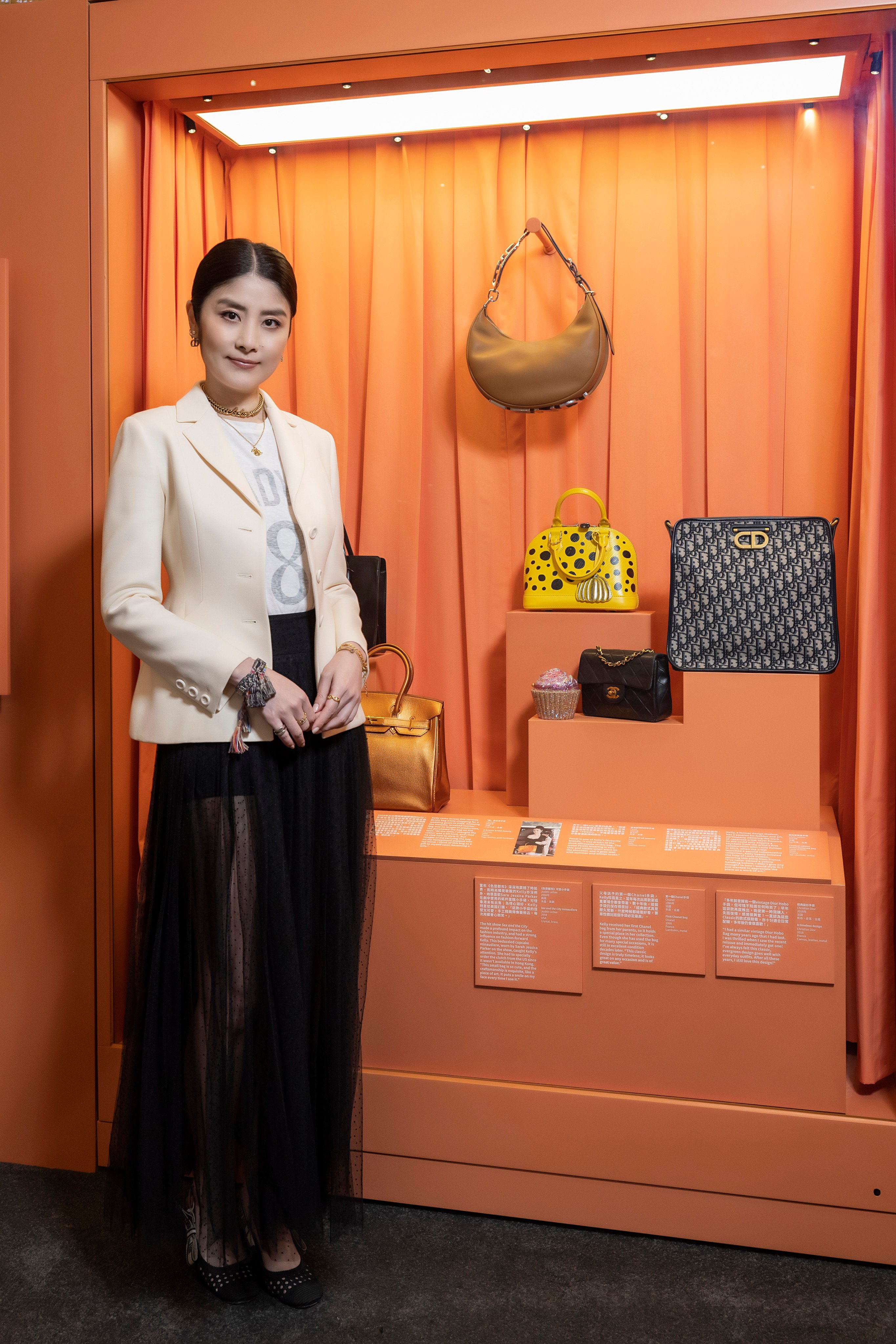 Hong Kong singer-actress Kelly Chen with handbags from her personal collection at the “Bags: Inside Out” exhibition, which includes iconic luxury handbags from brands including Hermes, Gucci and Fendi, at Pacific Place in Admiralty. Photo: Swire Properties