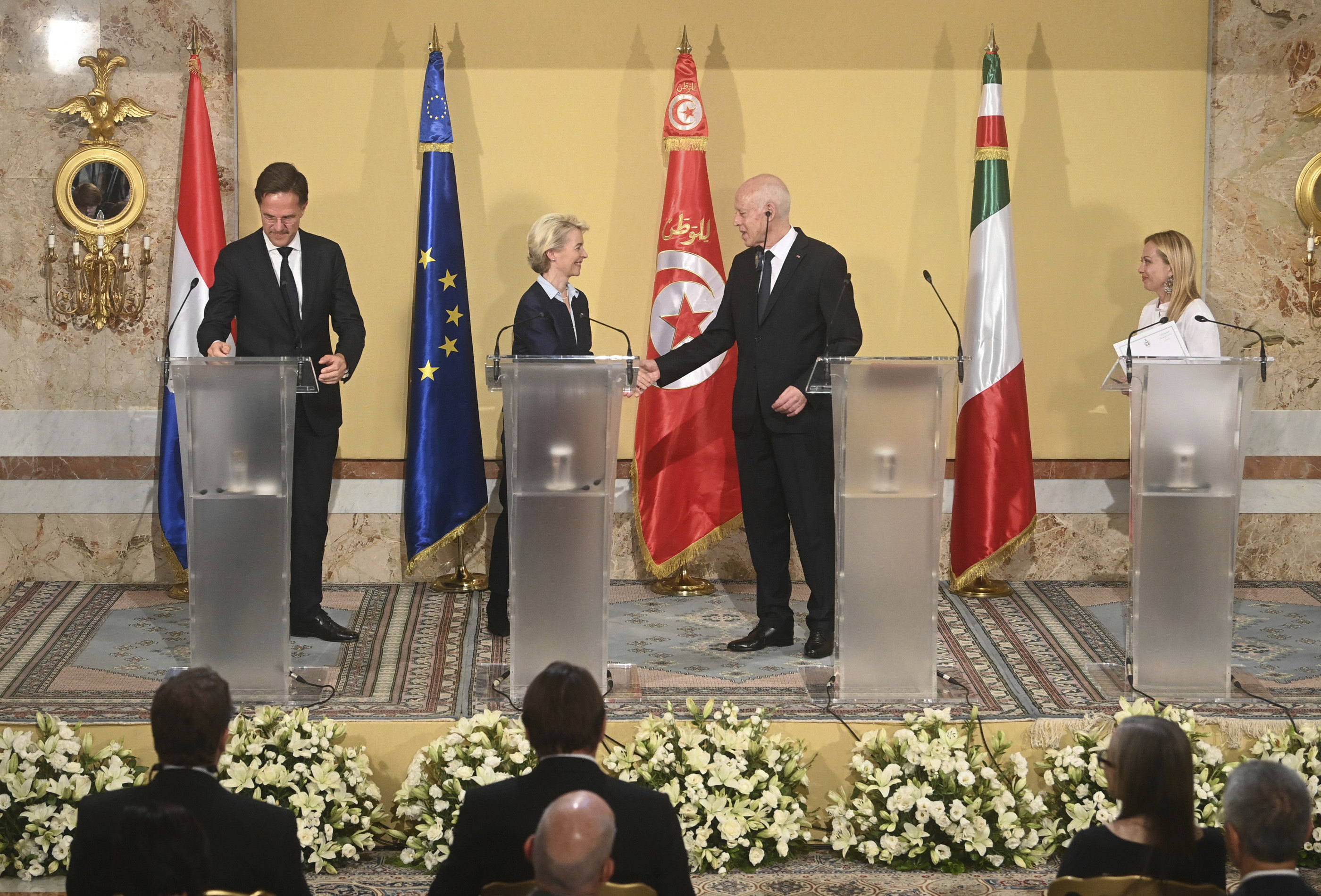 Tunisian President Kais Saied, centre right, shakes hands with  European Commission President Ursula von der Leyen, centre left, during a press conference with Netherlands’ Prime Minister Mark Rutte, left and Italian Prime Minister Giorgia Meloni, at the presidential palace in Carthage, Tunisia on Sunday. Photo: Tunisian Presidency via AP
