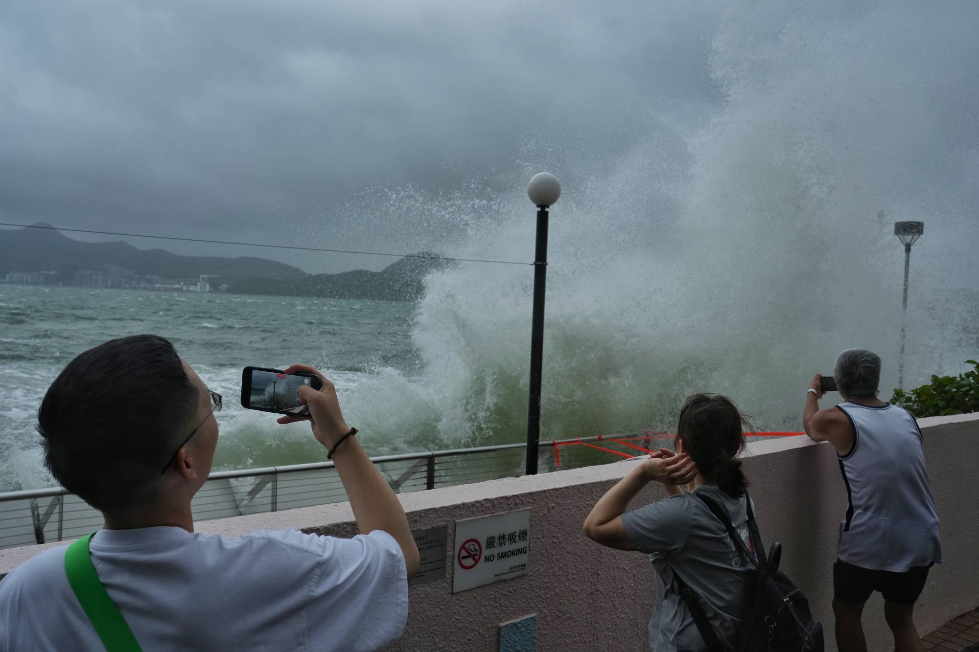 Hong Kong grinds to halt as Typhoon Talim lashes city, forcing school ...