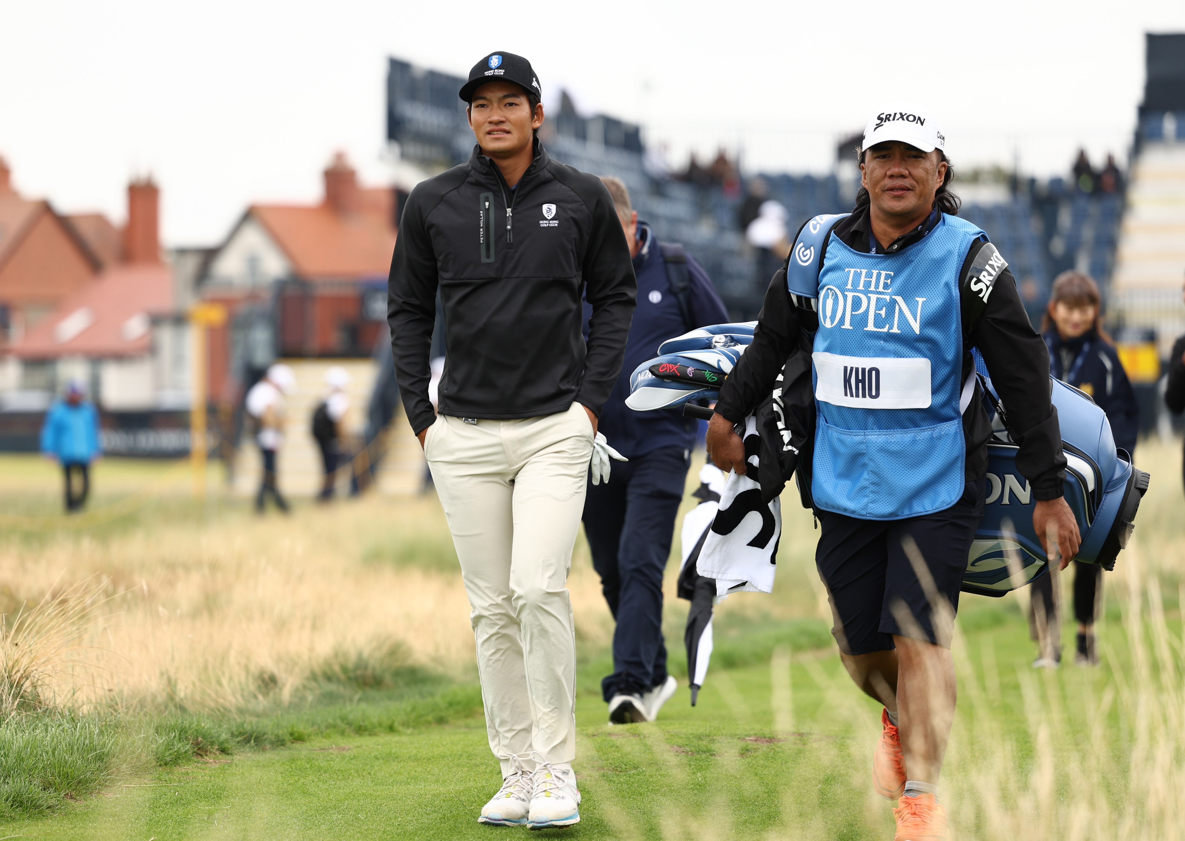 Taichi Kho and his caddie walk towards a fairway during a practice round at Royal Liverpool Golf Club. Photo: EPA-EFE