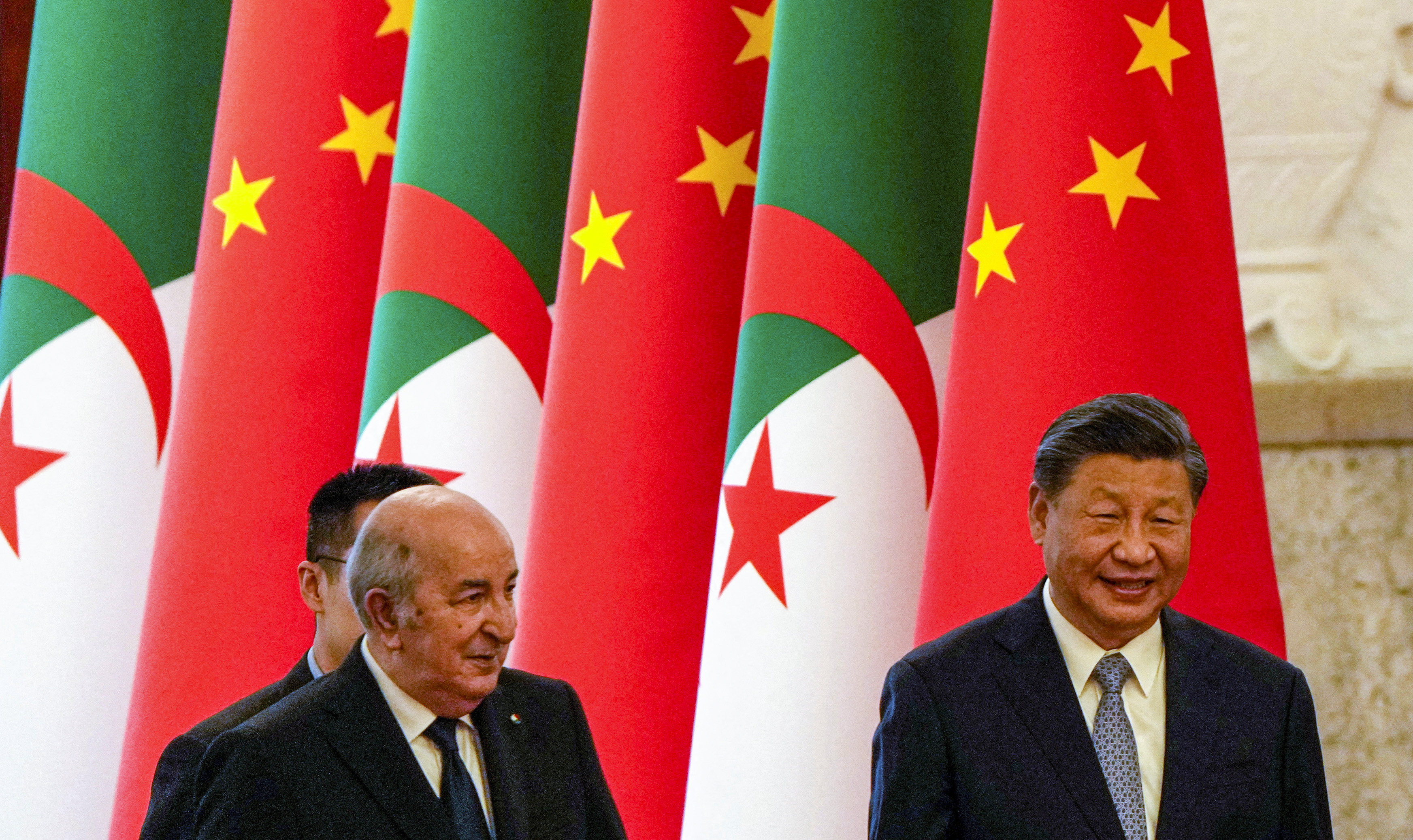 China’s President Xi Jinping walks with Algeria’s President Abdelmadjid Tebboune during a welcome ceremony at the Great Hall of the People in Beijing on July 18, 2023. Photo: Reuters