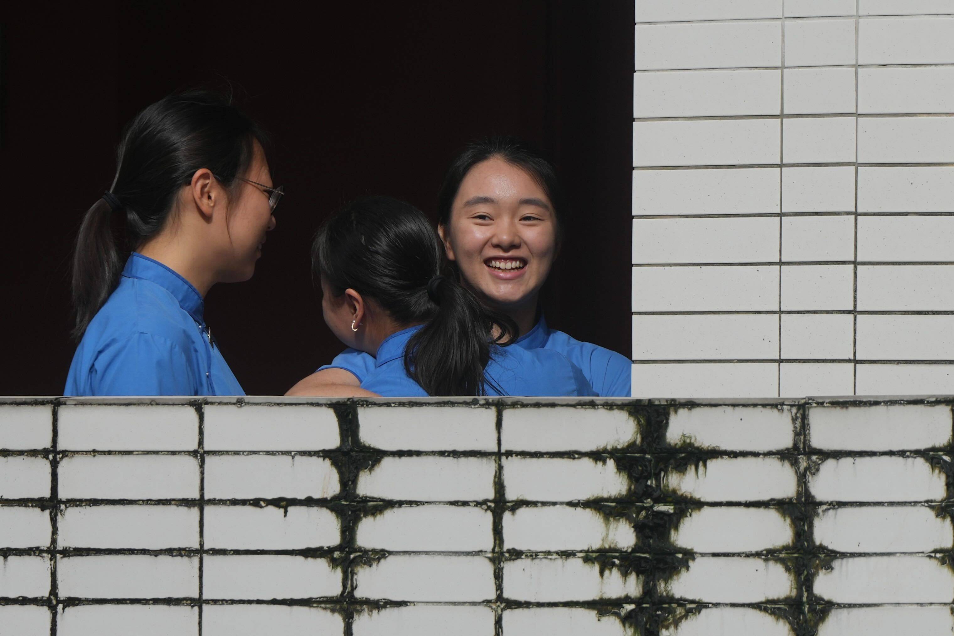 Students receive their DSE results at St Paul’s Co-educational College. Photo: Sam Tsang 