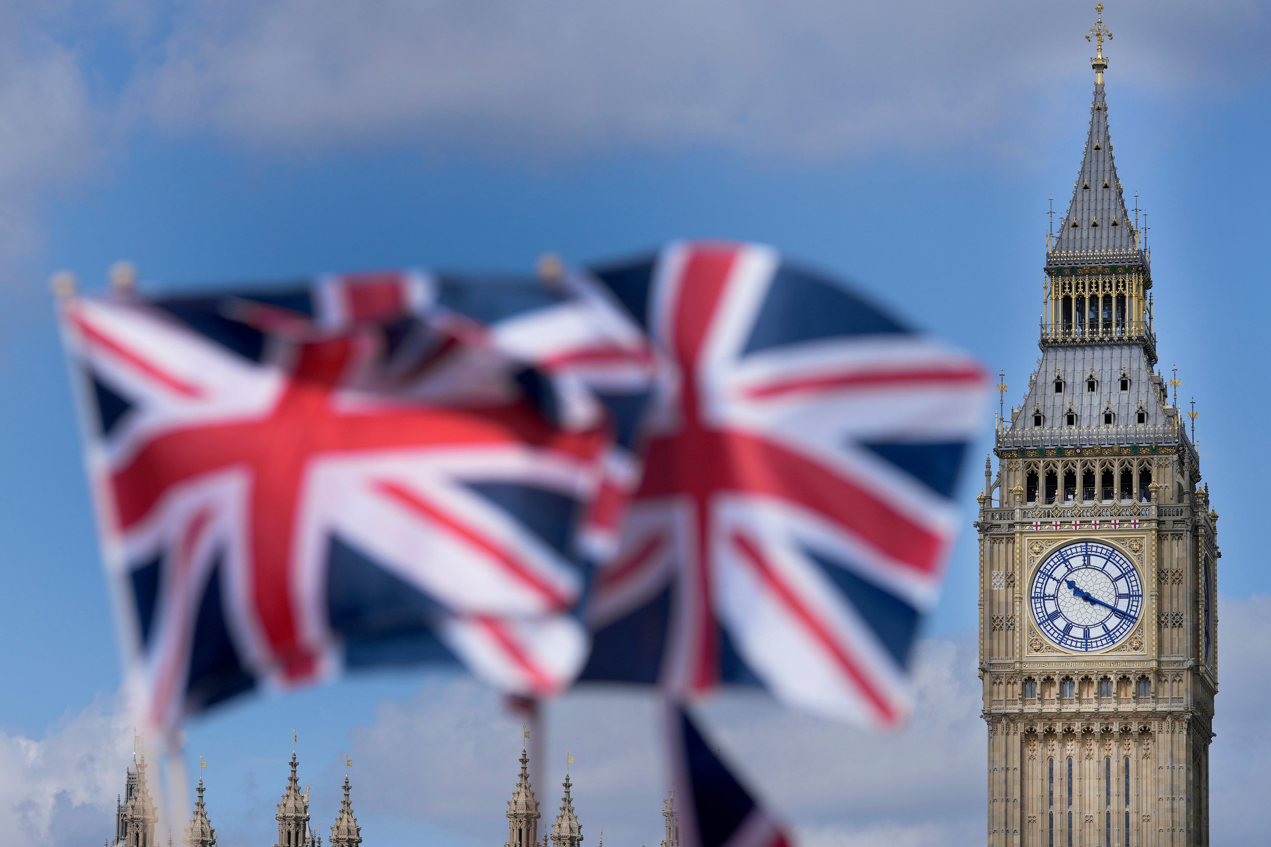 Union Jack flags are seen in front of the Elizabeth Tower, known as Big Ben, beside the Houses of Parliament in London, on June 24, 2022. Photo: AP 