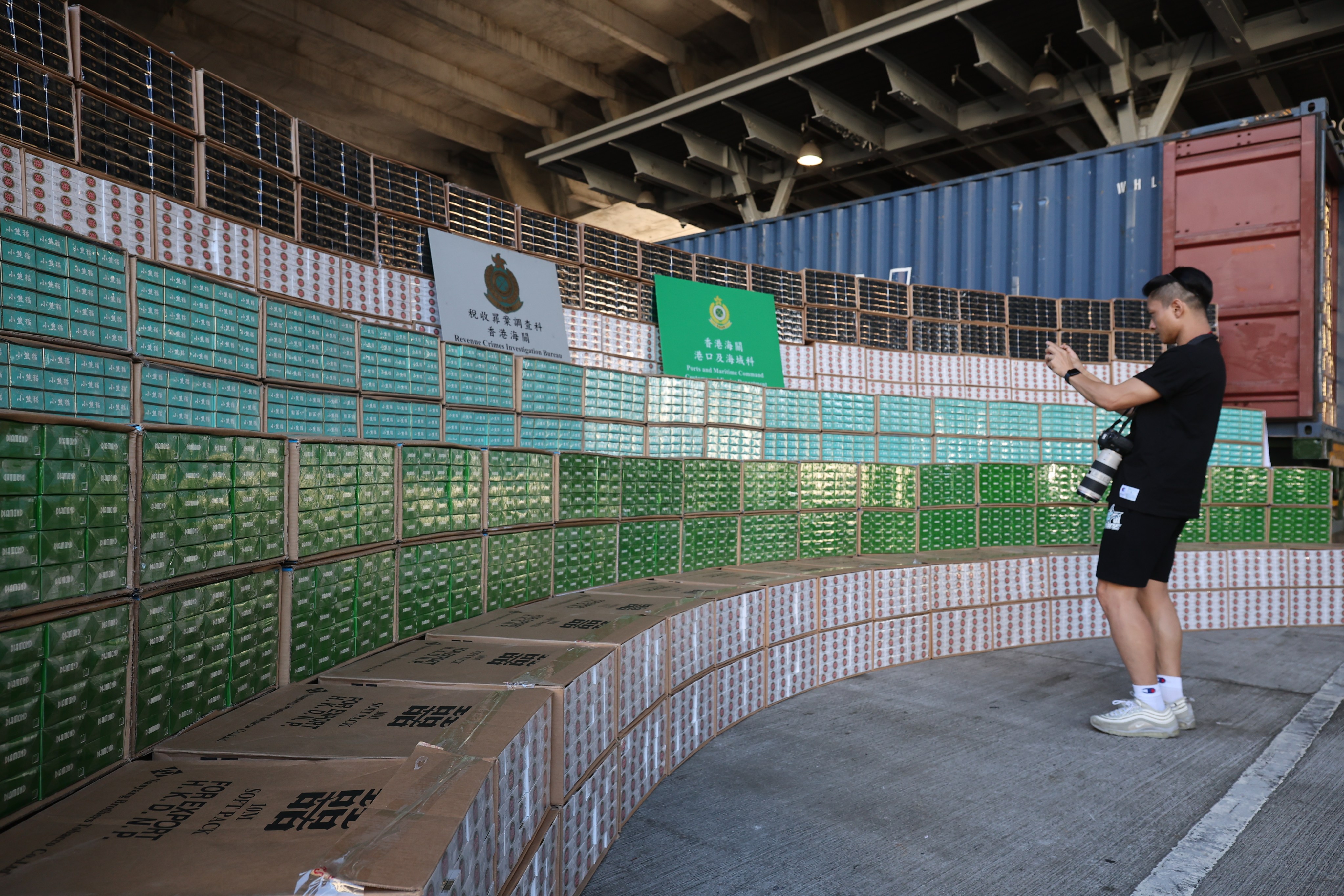 Customs officials show off a massive HK$82 million haul of smuggled cigarettes earlier this month. Photo: Edmond So