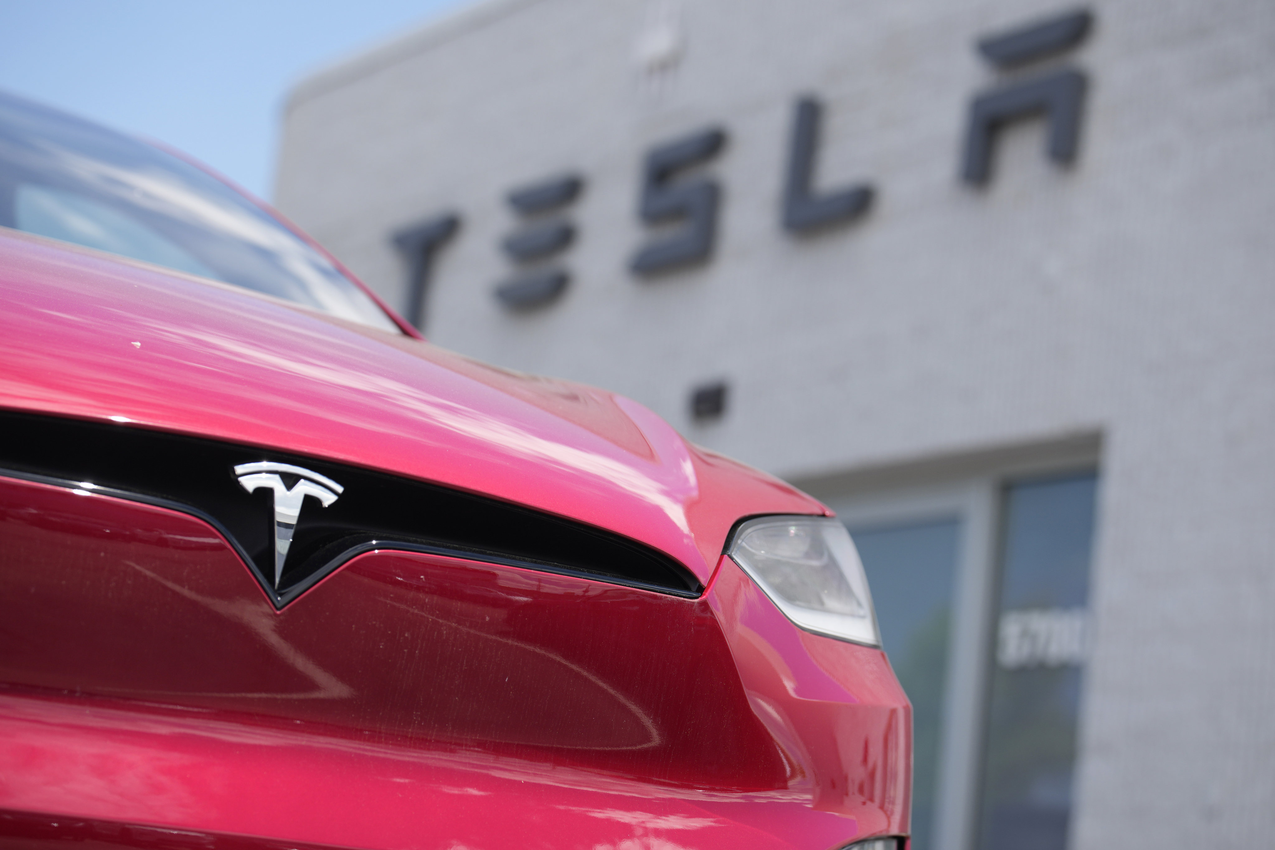 A 2023 Model X sports-utility vehicle sits outside a Tesla dealership on June 18 in Littleton, Colorado. Photo: AP
