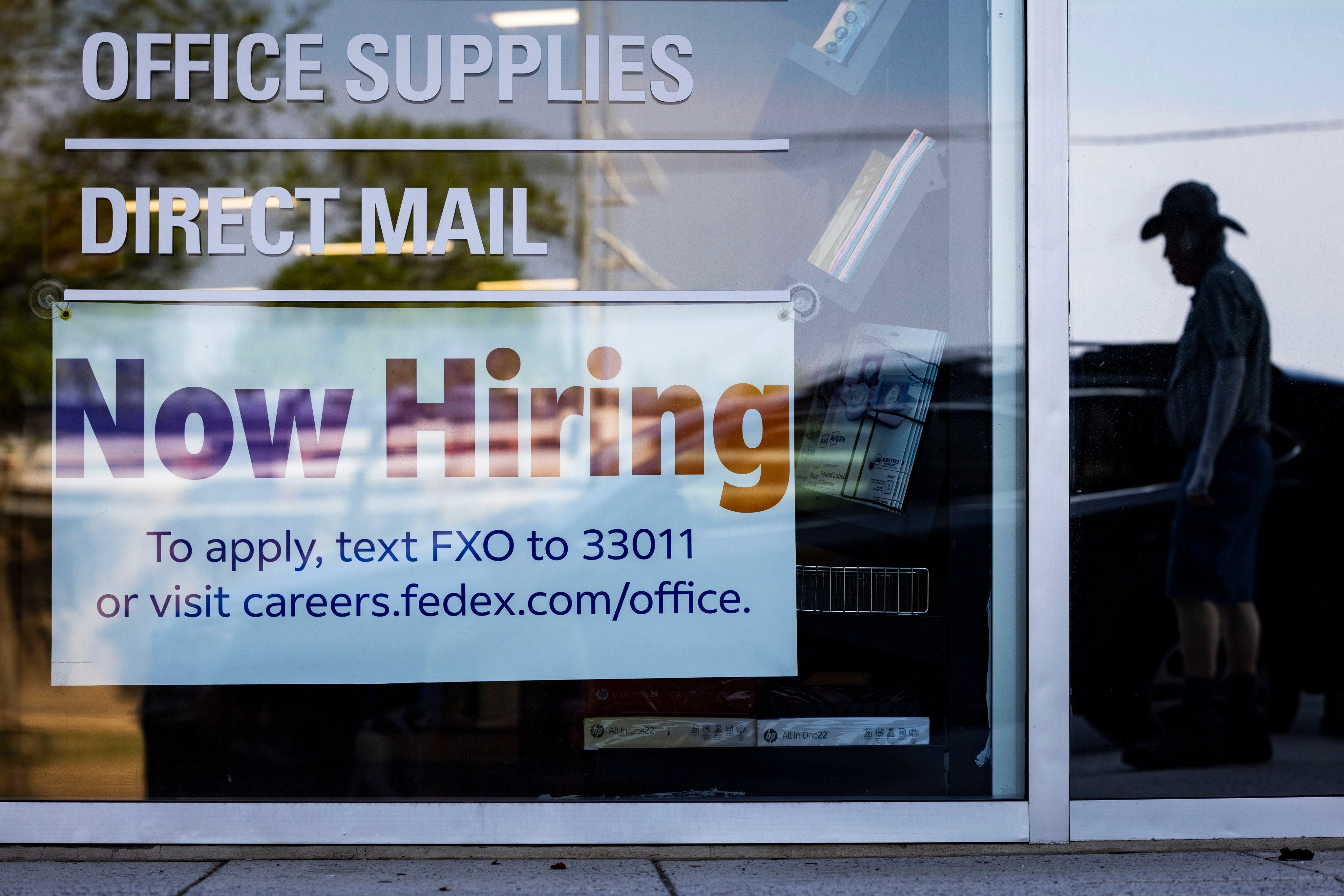 A “now hiring” sign on the window of a FedEx office in Washington on July 7. According to the Labour Department, the US economy added 209,000 jobs in June, far fewer than the predicted number of 240,000 jobs. The unemployment rate fell to 3.6 per cent. Photo: EPA-EFE