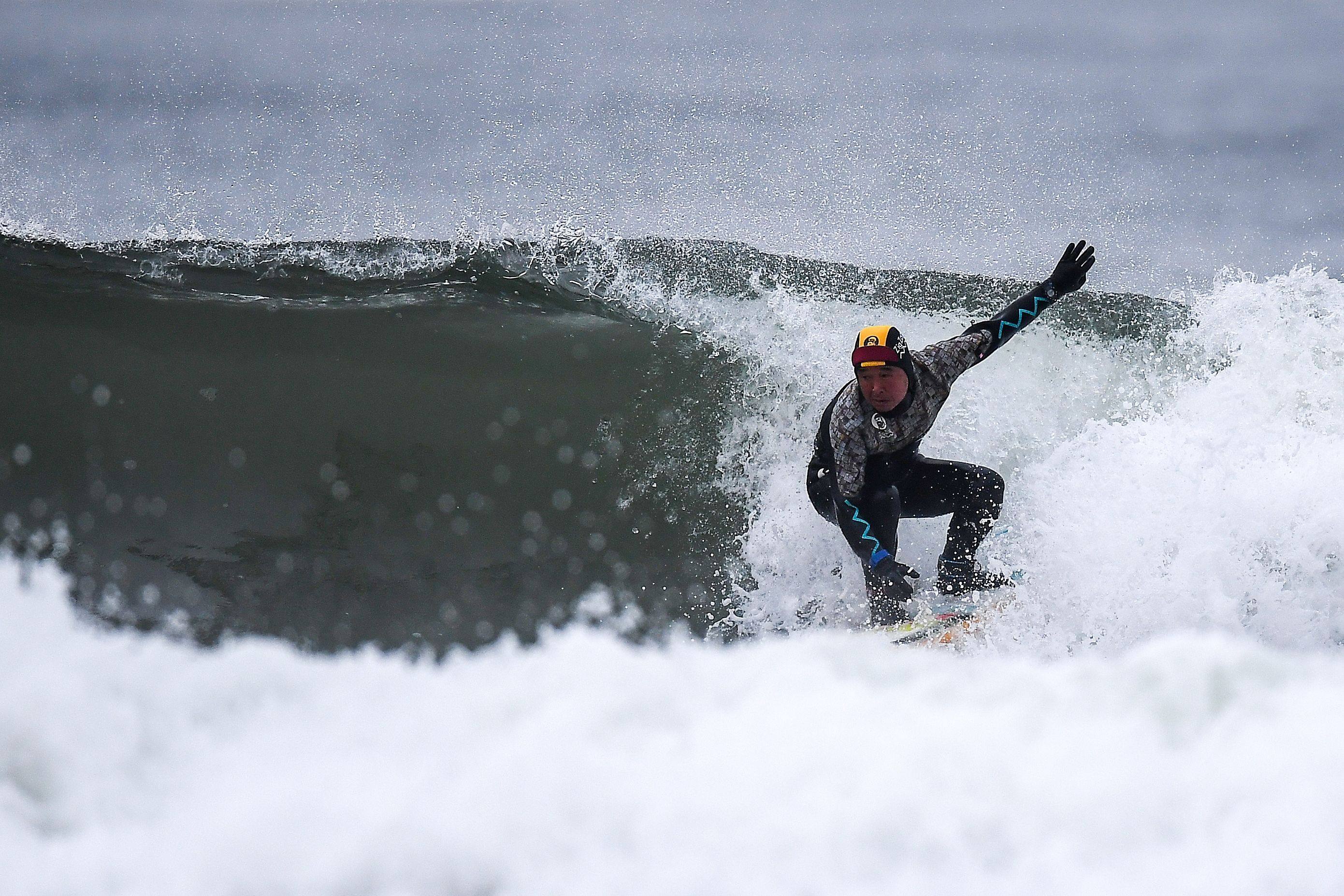 A surfer riding a wave in Minamisoma, Fukushima prefecture. Photo: AFP