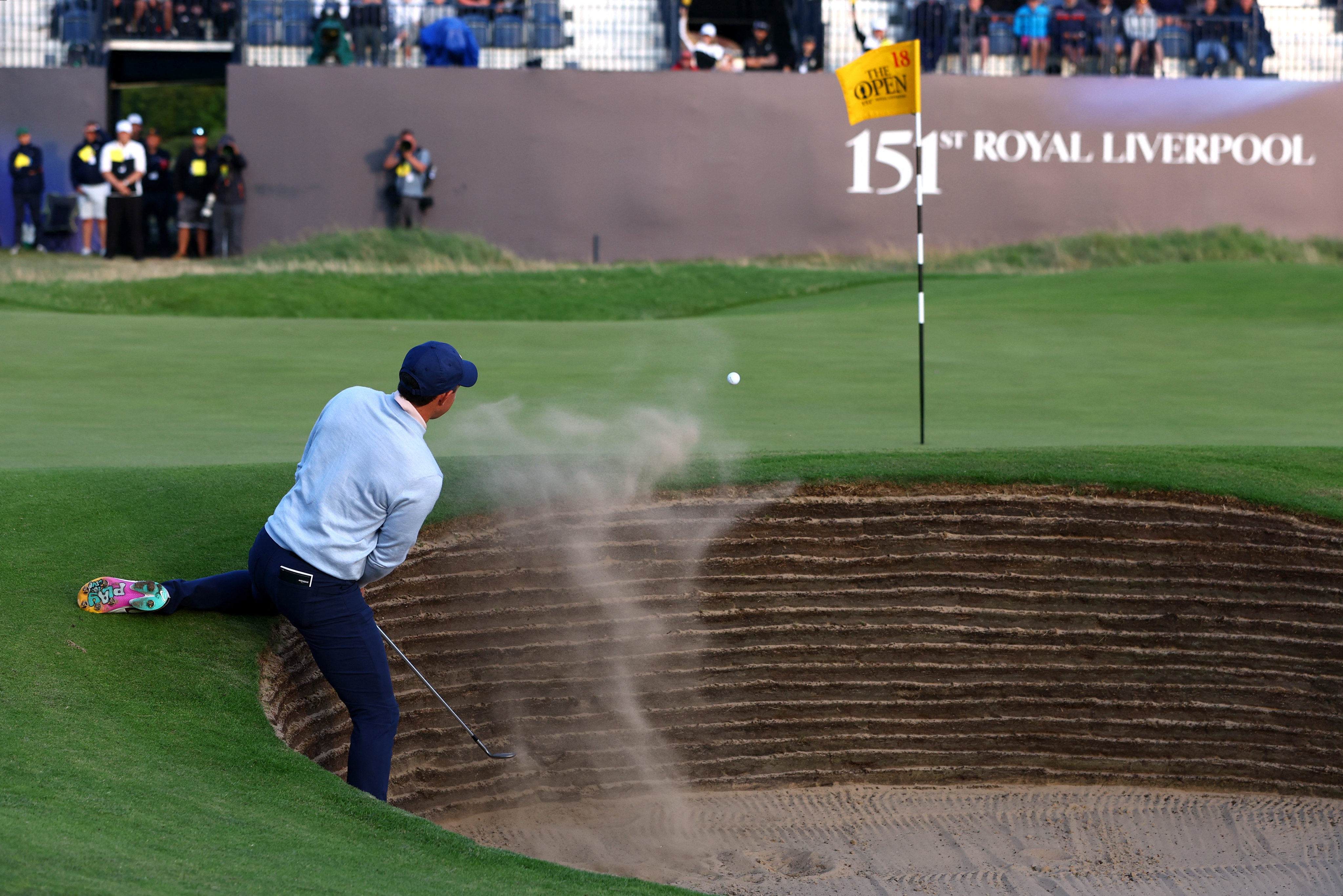 Rory McIlroy plays out of a bunker on the 18th hole during the first round at Royal Liverpool. Photo: Reuters