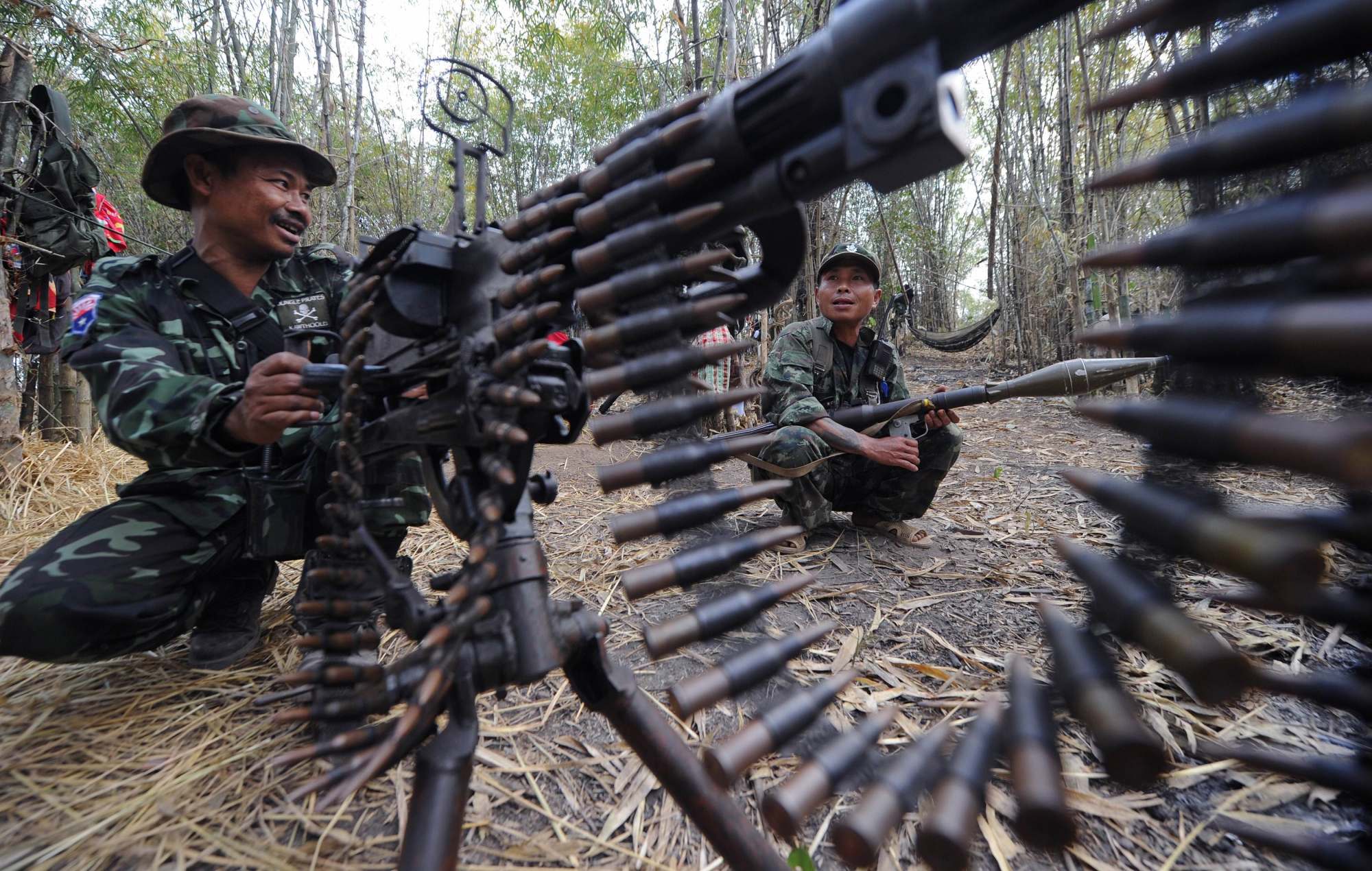 Members of the Karen National Union ethnic armed group stand guard with their weapons near the Myanmar-Thai border in 2012. A spokesman for the group denied that any of its leaders were involved in the scam centres. Photo: AFP