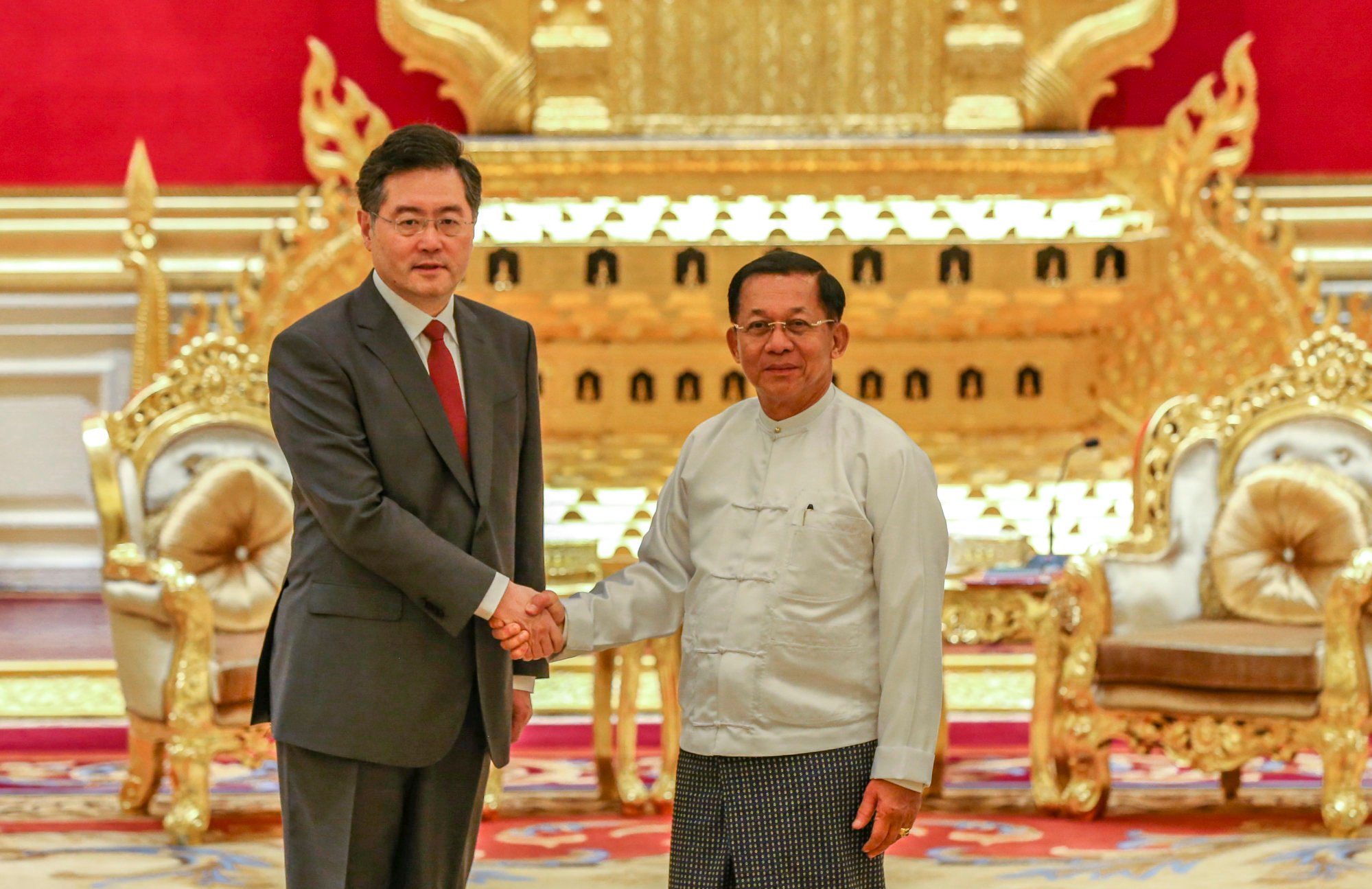 China’s Foreign Minister Qin Gang (left) shakes hands with Myanmar junta chief Min Aung Hlaing during a meeting in Naypyidaw on May 2. China remains one of the internationally isolated country’s few patrons post-coup. Photo: Xinhua