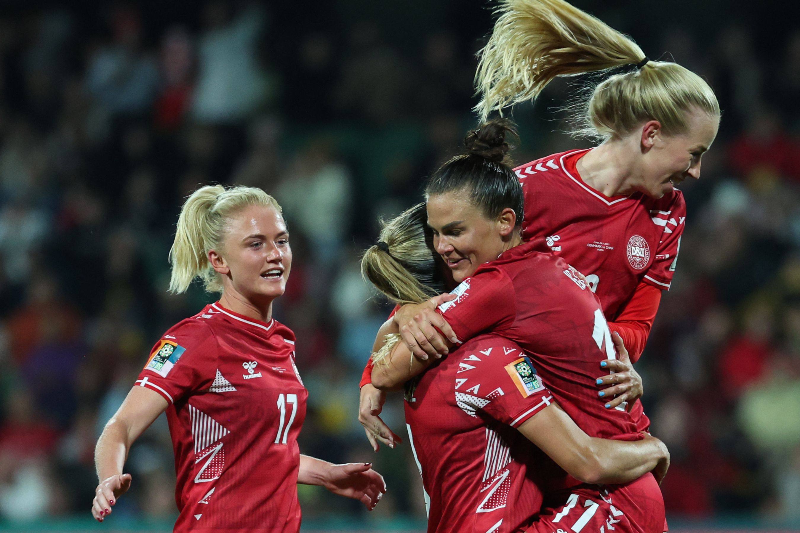 Denmark players celebrate after scoring a late winner against China in Perth. Photo: AFP