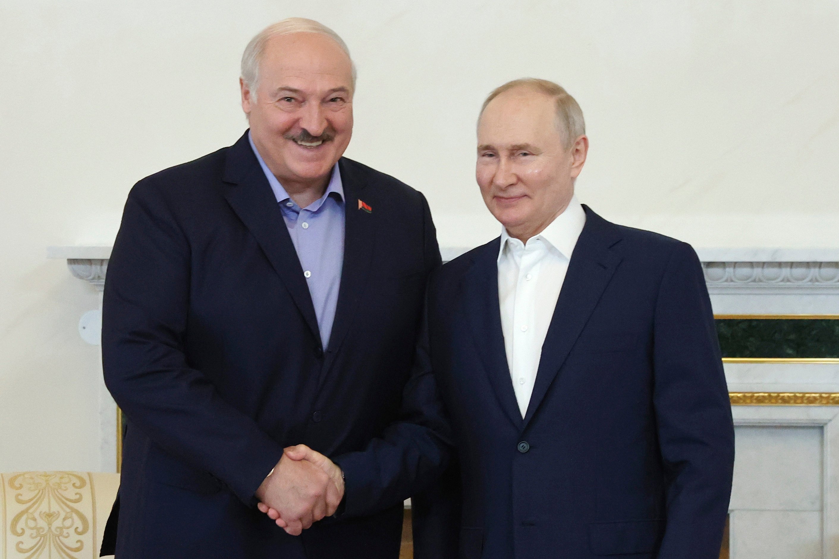 Russian President Vladimir Putin (right) and Belarusian President Alexander Lukashenko during their meeting in St Petersburg on Sunday. Photo: via AP