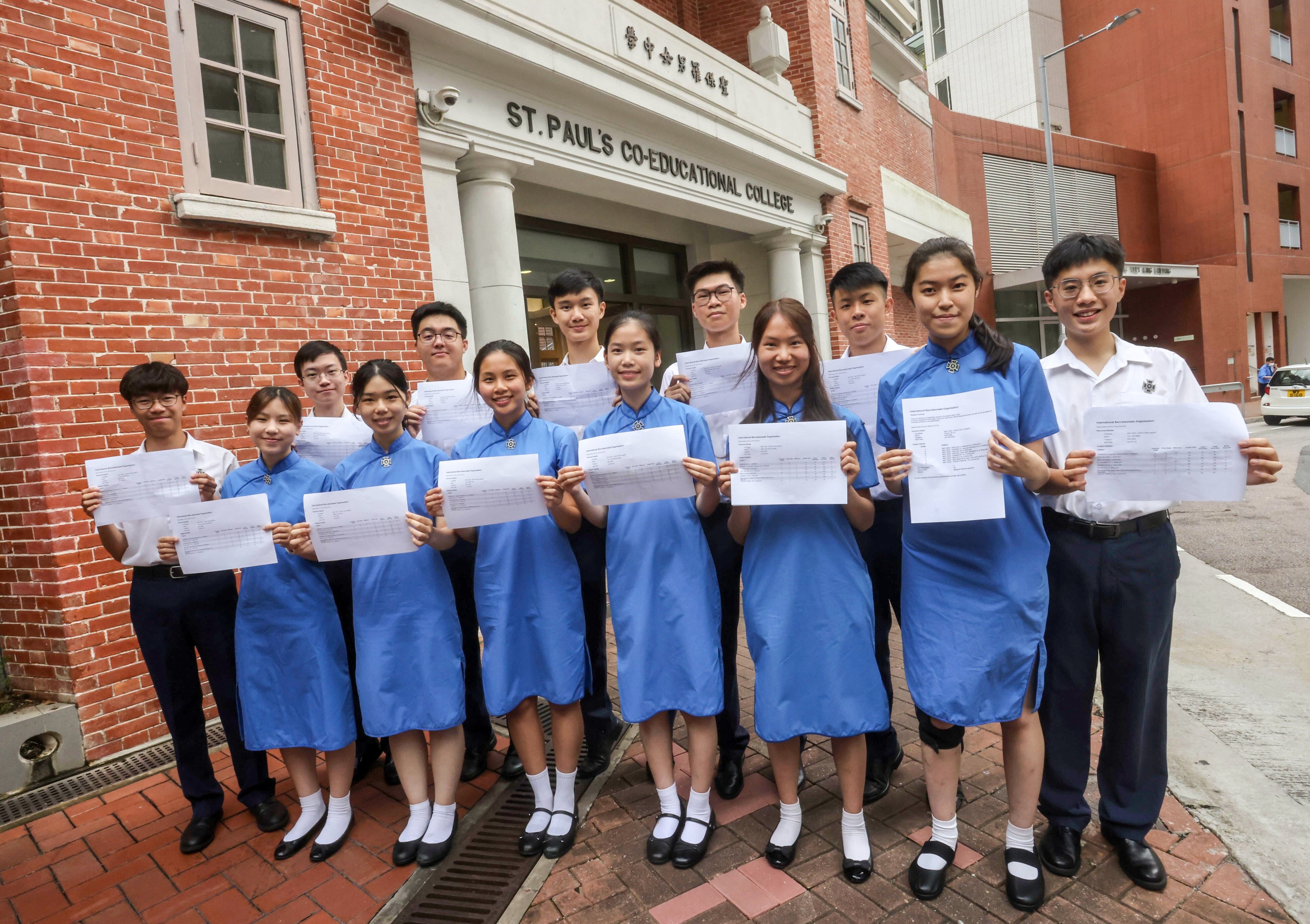 High-scoring students from St Paul’s Co-educational College show off their IB results. Photo: Jonathan Wong