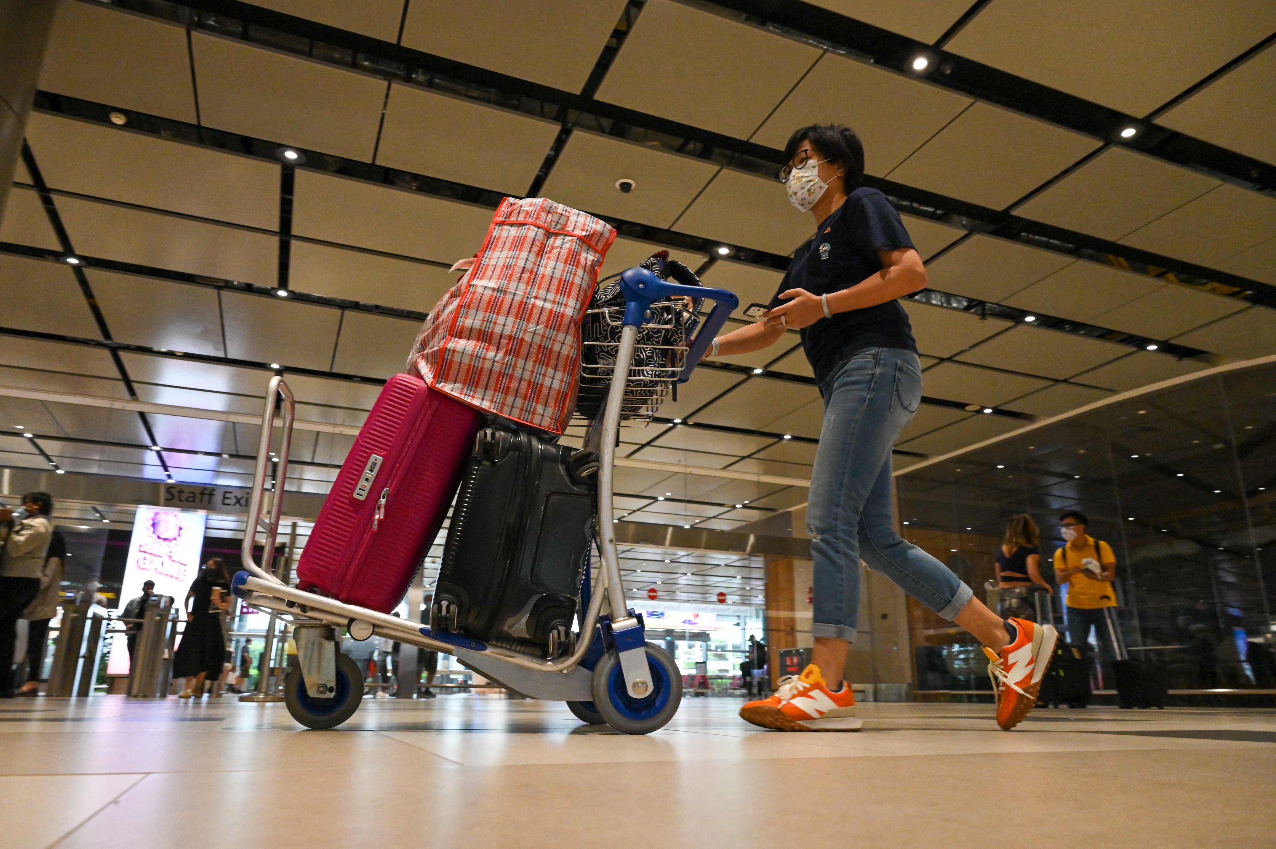 A traveller at Changi Airport. China is resuming visa-free entry for Singapore citizens from Wednesday. Photo: AFP