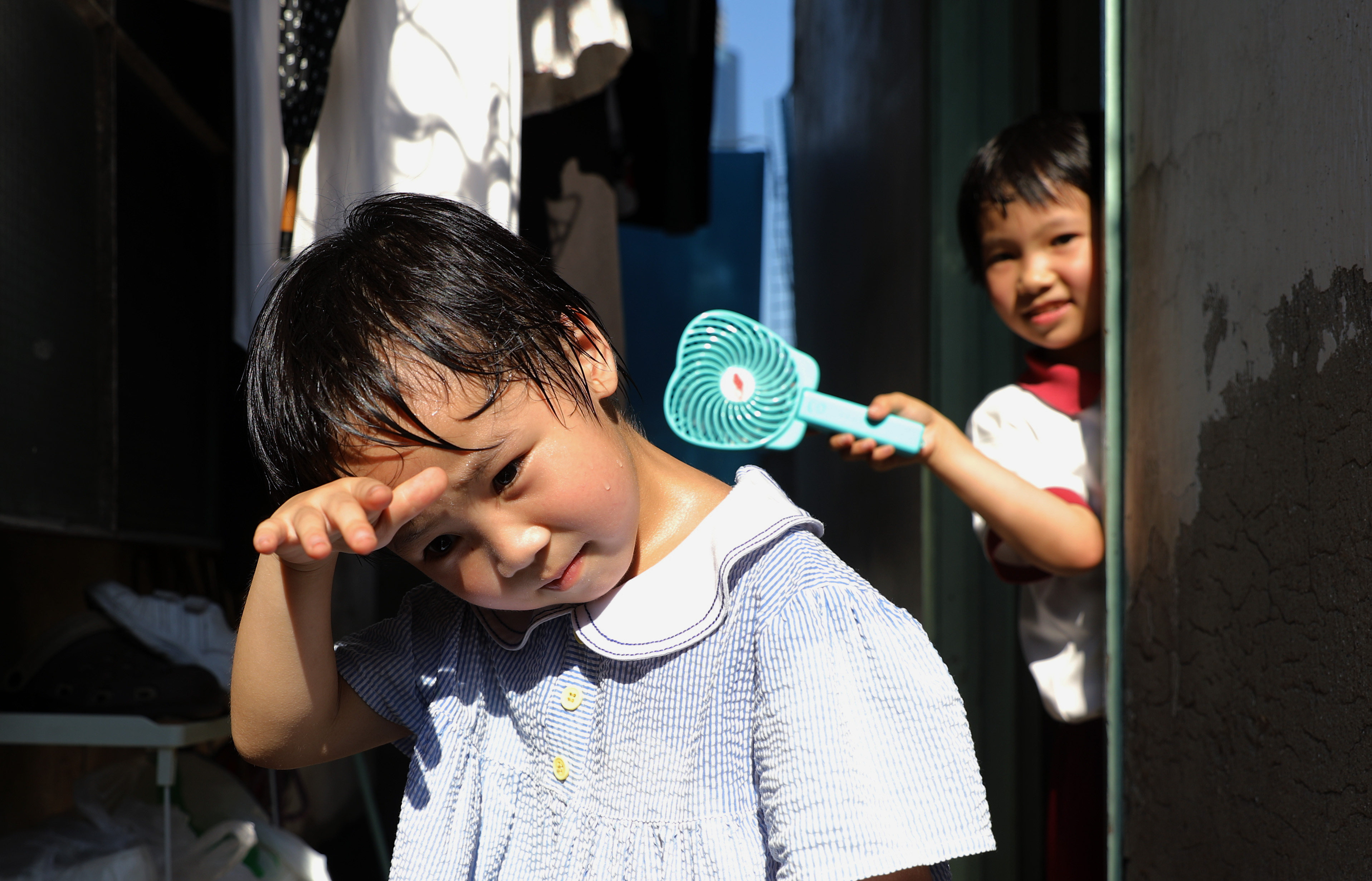 A child in Tai Kok Tsui sweats in Hong Kong’s heatwave in May 2018 when temperatures went above 35 degrees Celsius. Last year, the hottest day saw the mercury hit 36.1 degrees. And this year has a “high chance” of being among the city’s top 10 hottest on record, said the Observatory. Photo: Sam Tsang