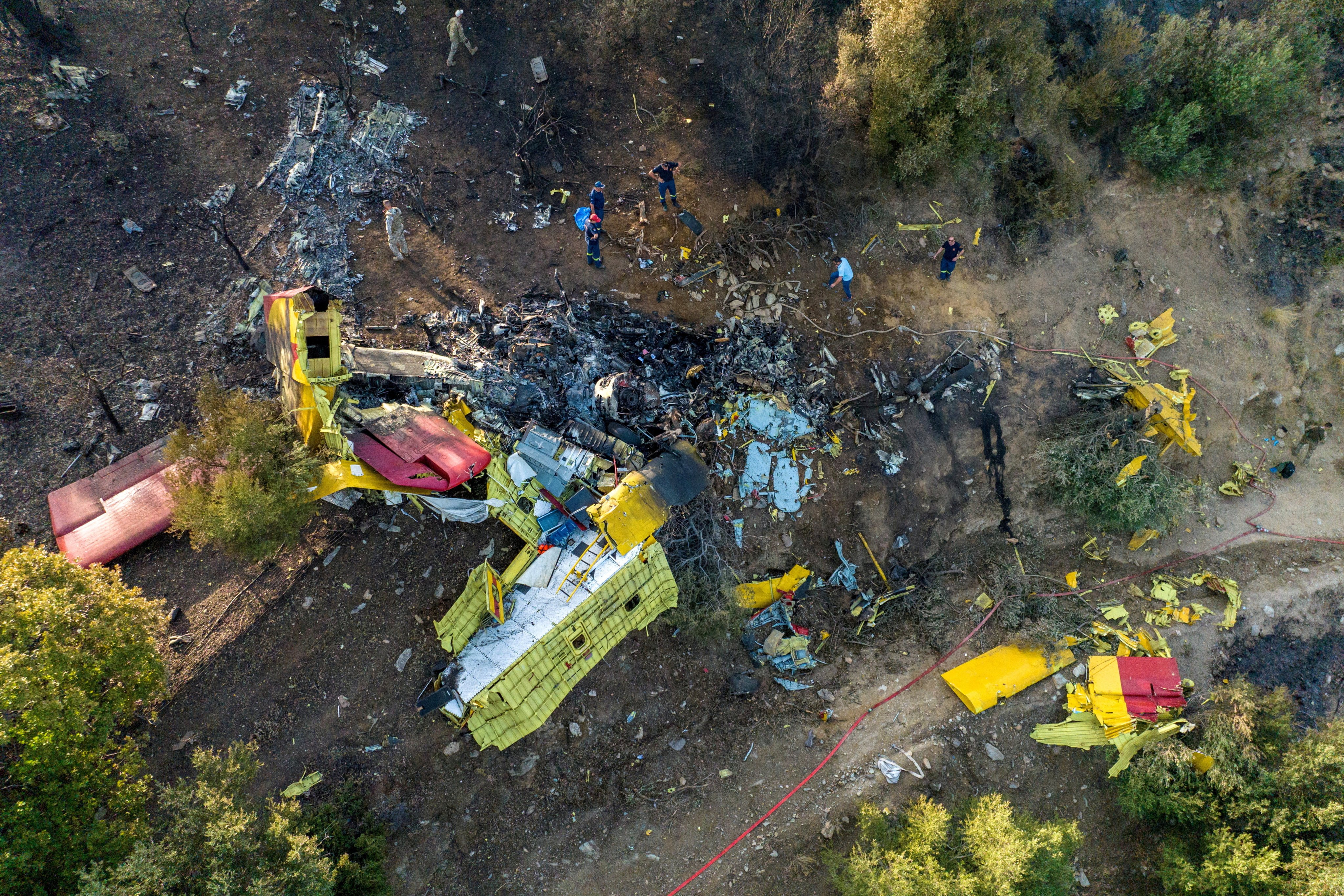 Rescuers operate at the site where a firefighting plane crashed on the island of Evia, Greece, on Tuesday. Photo: Reuters